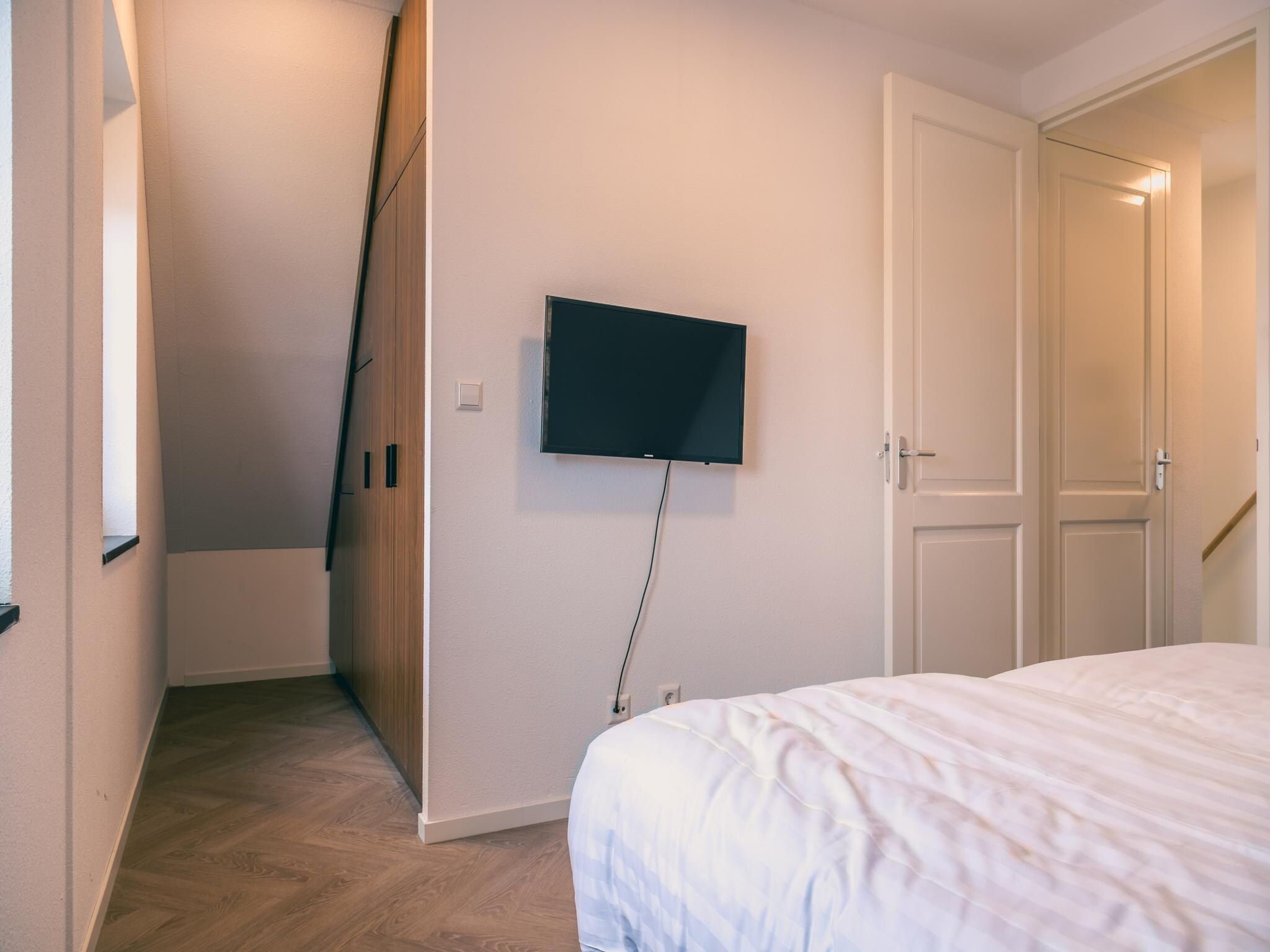 Een slaapkamer van Watervilla Sauna 6 in Medemblik