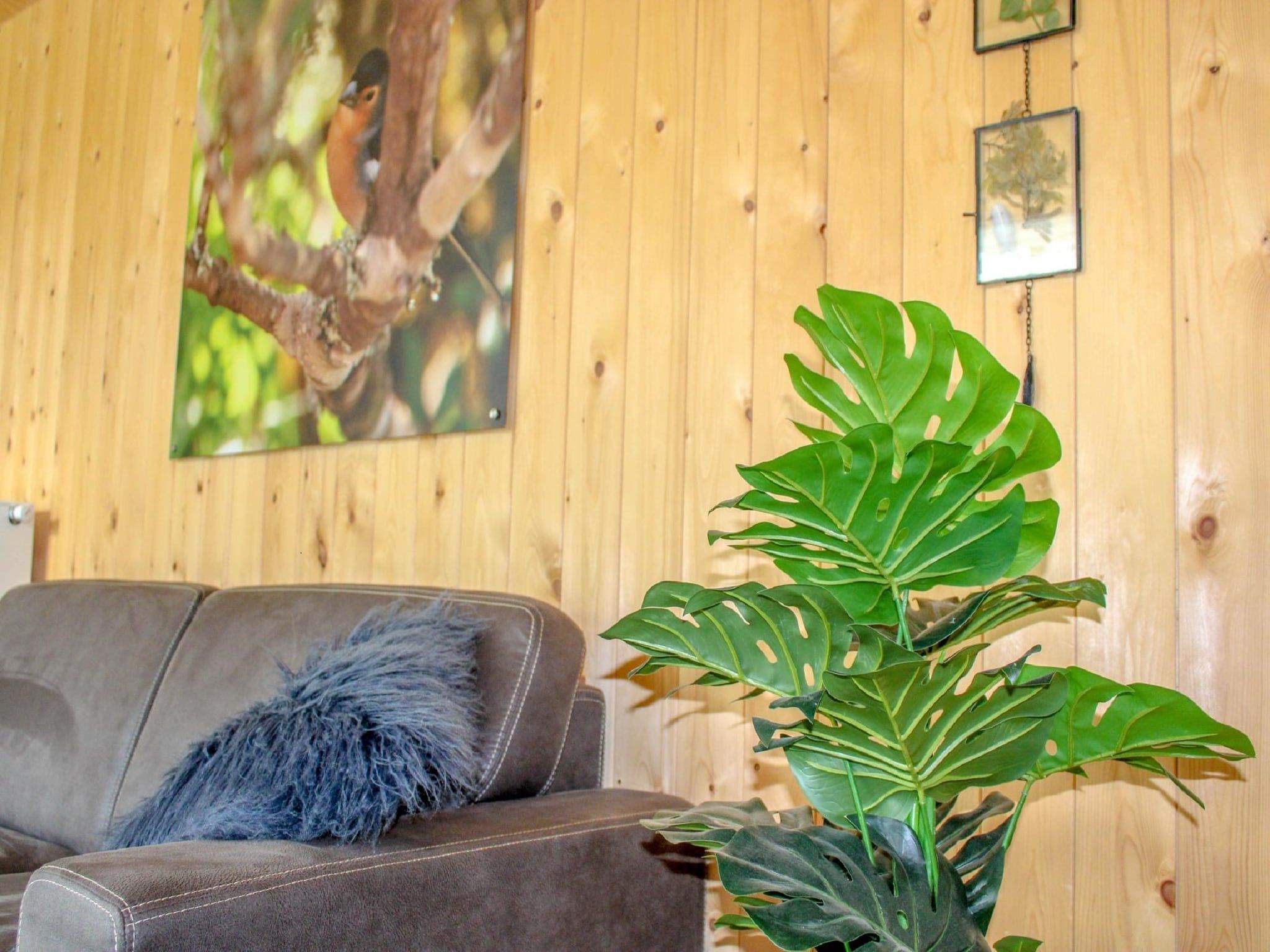 De woonkamer van Vakantiepark De Rimboe & De Woeste Hoogte 27 in Hoenderloo