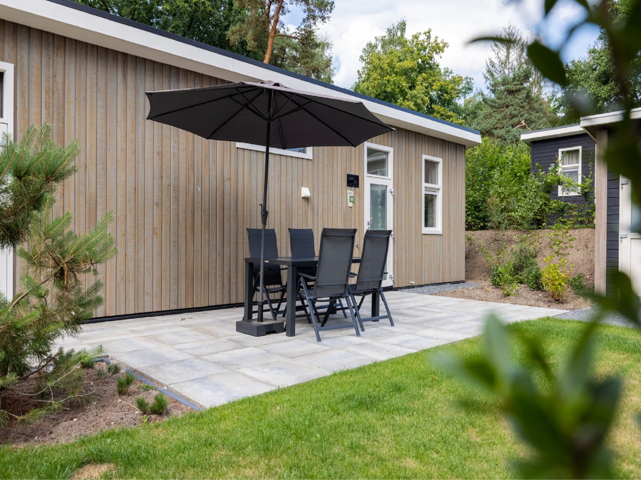 De woonkamer van Vakantiepark De Rimboe & De Woeste Hoogte 27 in Hoenderloo