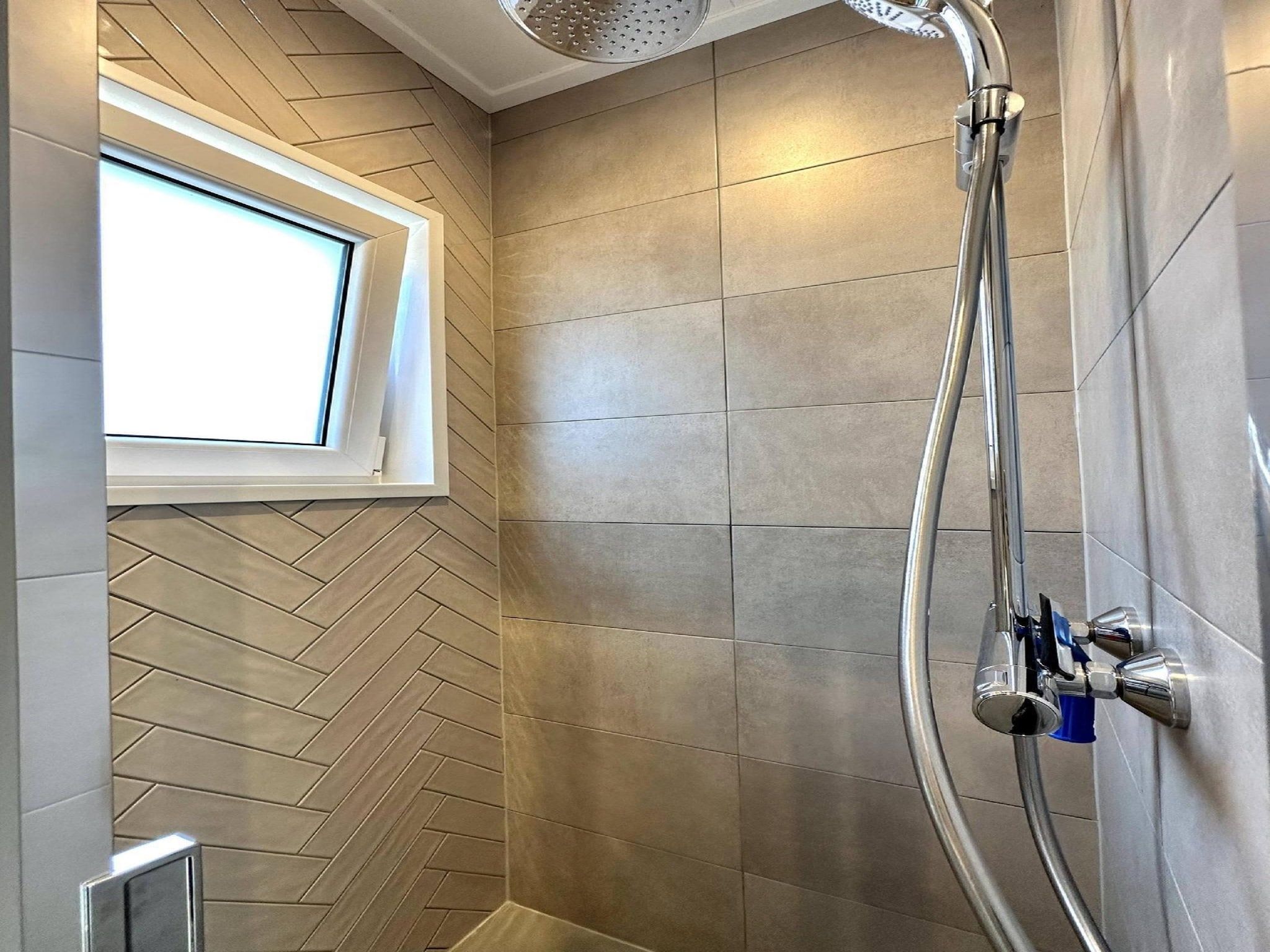 De badkamer van Vakantiepark De Rimboe & De Woeste Hoogte 28 in Hoenderloo