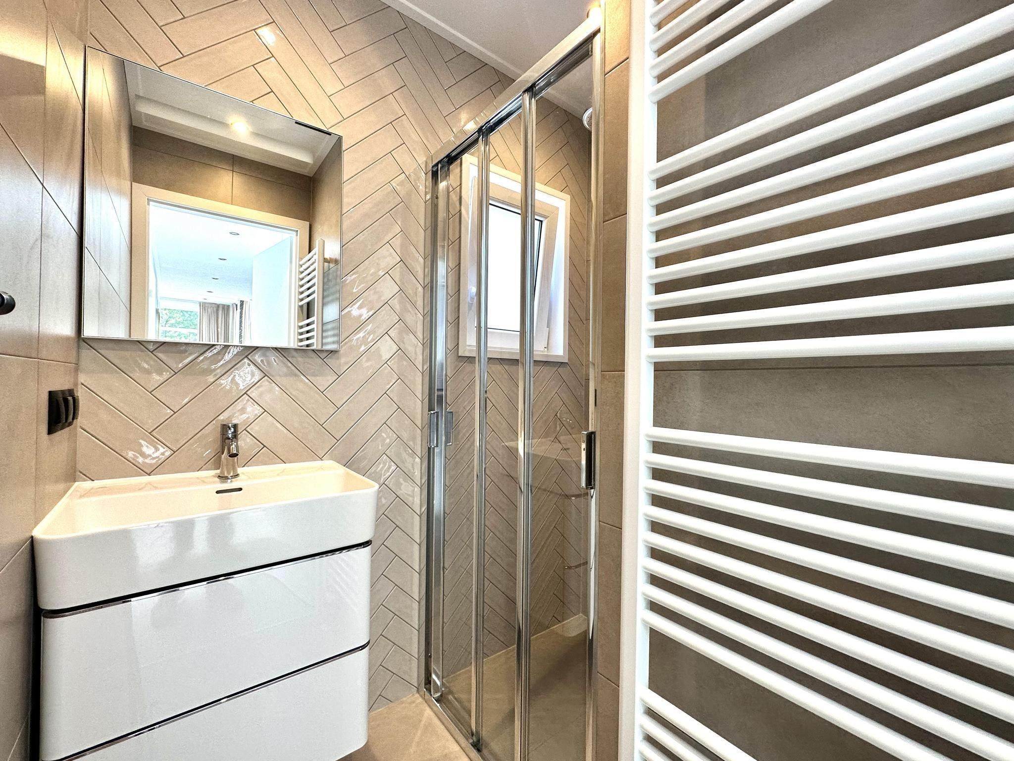 De badkamer van Vakantiepark De Rimboe & De Woeste Hoogte 28 in Hoenderloo