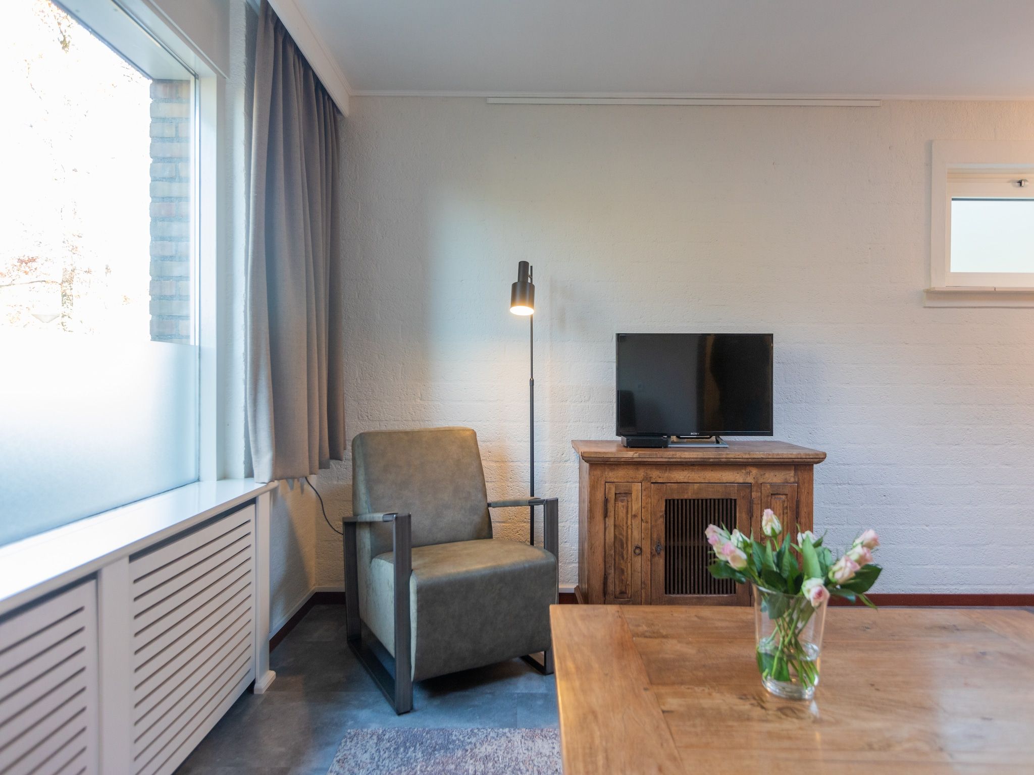 De woonkamer van Vakantie bij Meeussen - Schuttersoord 4 in Mook