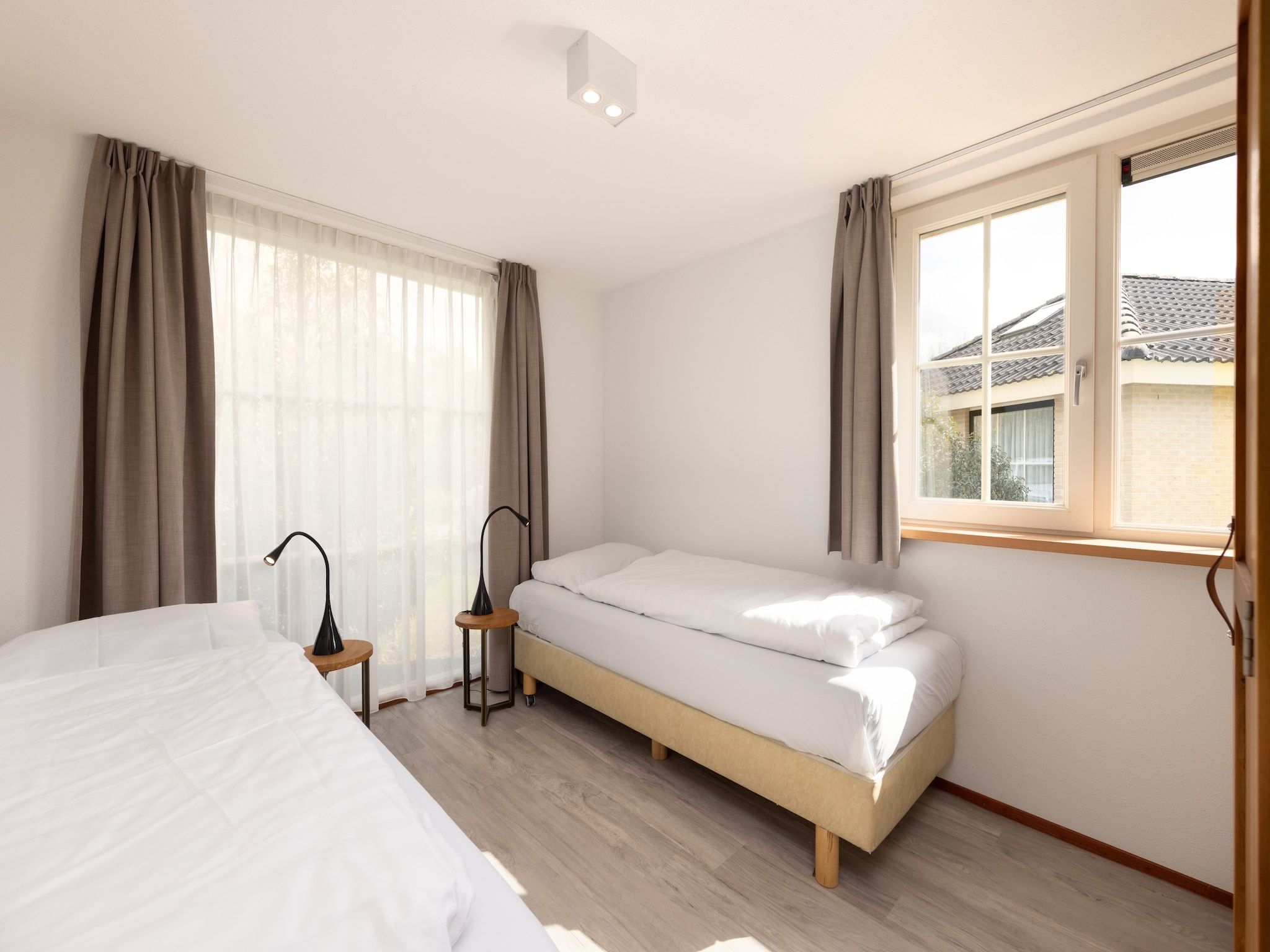 Een slaapkamer van De Veluwse Hoevegaerde 5 in Putten