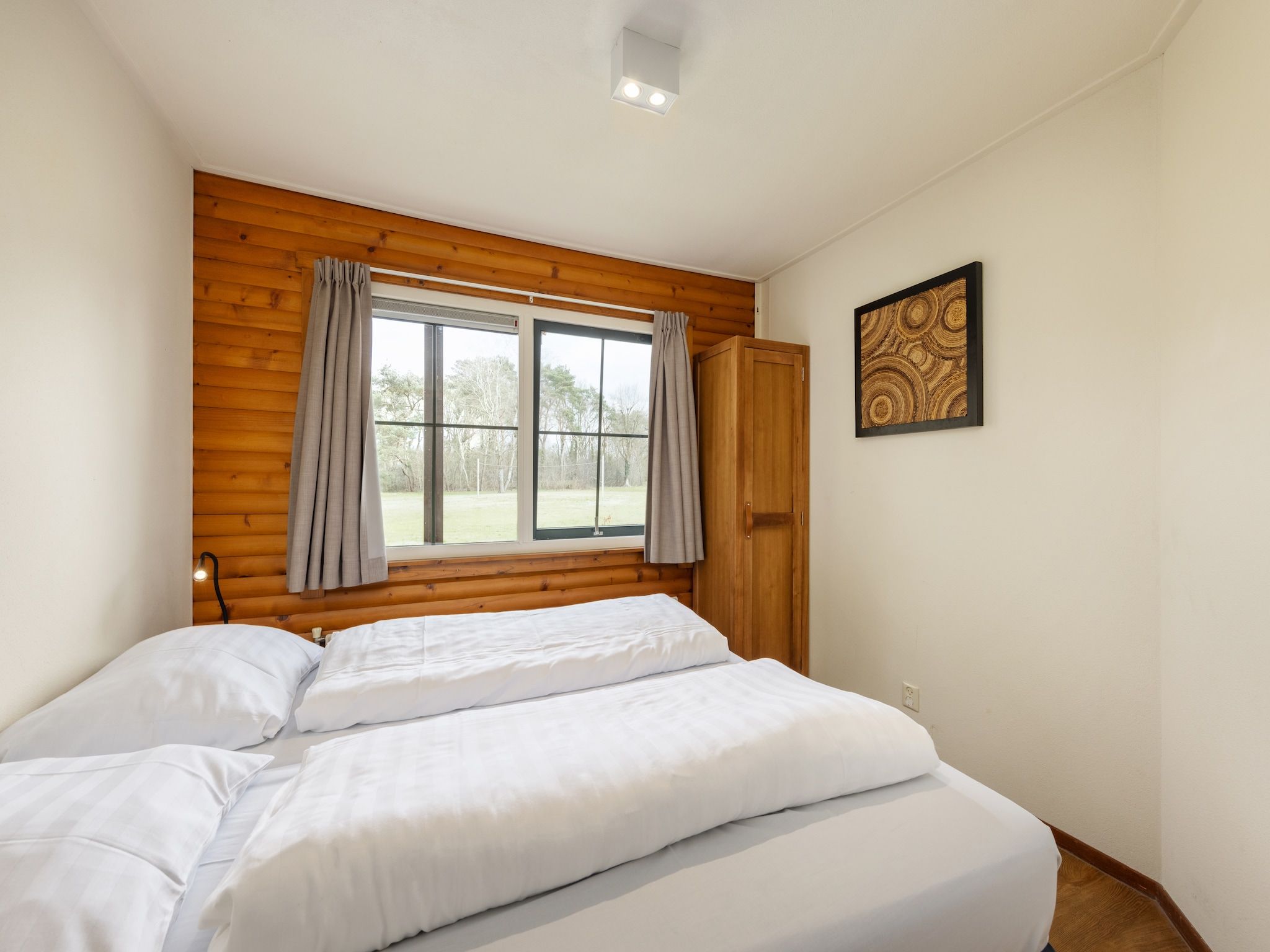 Een slaapkamer van De Veluwse Hoevegaerde 7 in Putten