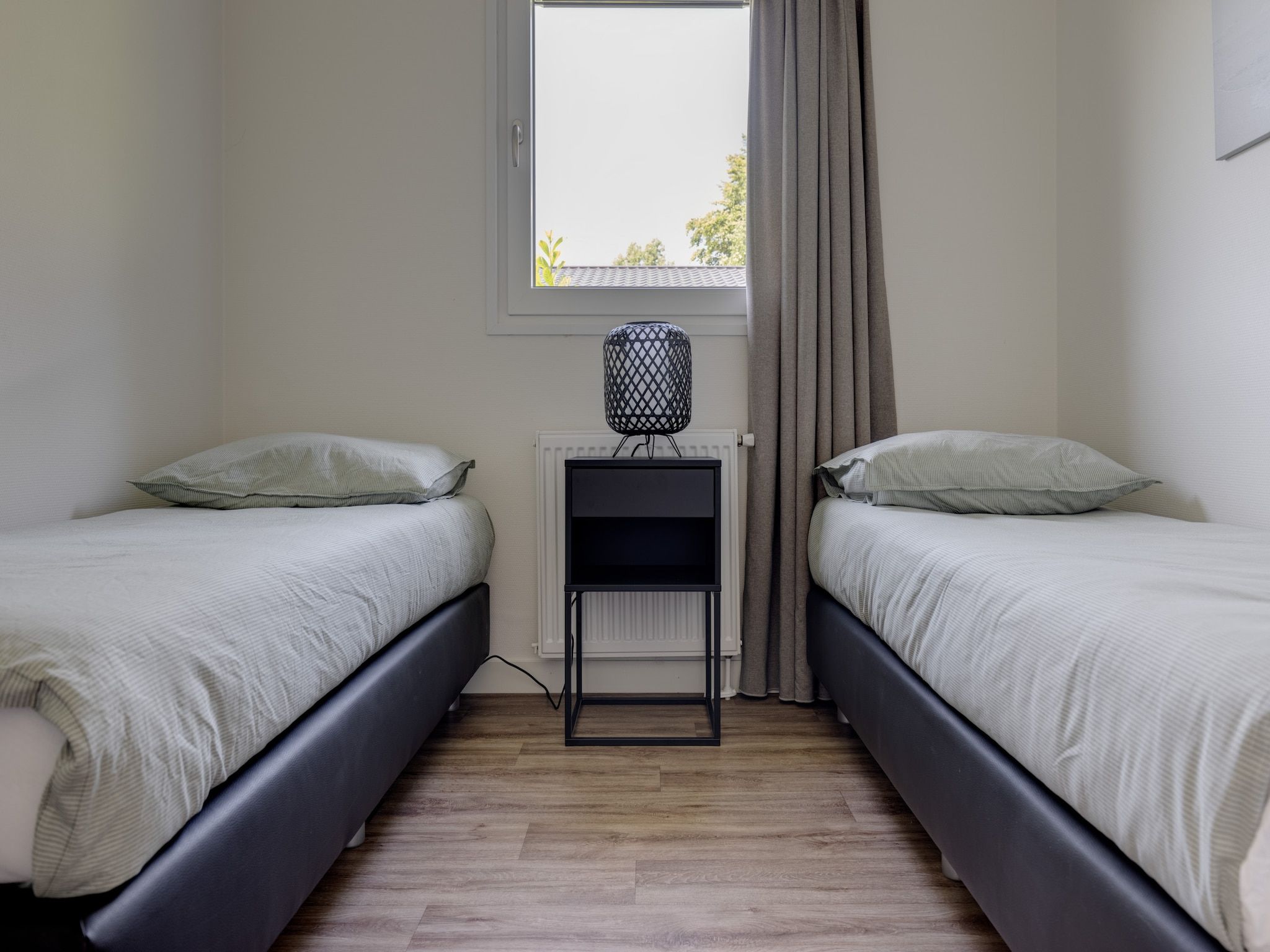 Een slaapkamer van Vakantiepark Molenvelden 4 in Veldhoven