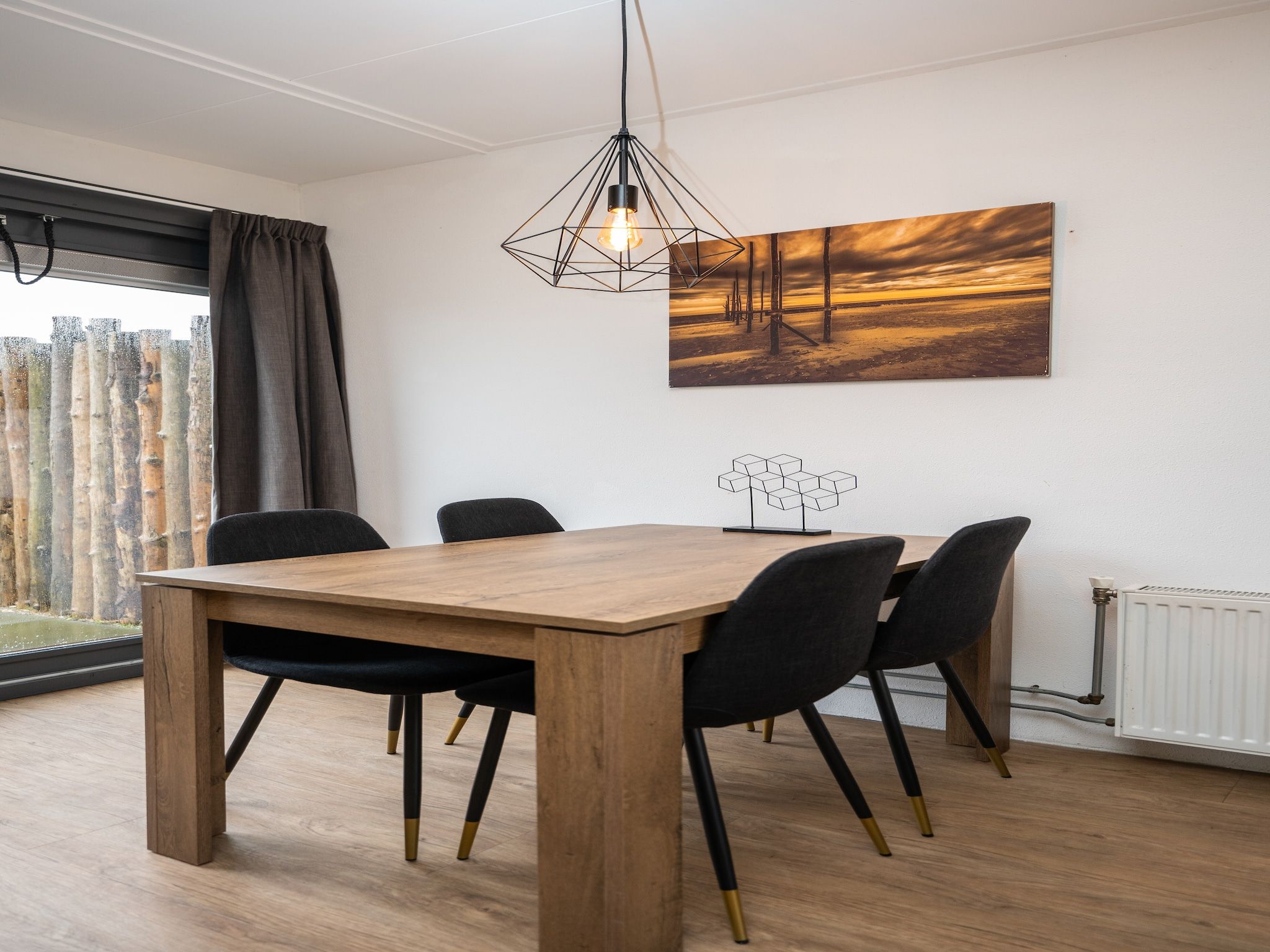 De woonkamer van Vakantiepark 't Eibernest Texel 3 in De Cocksdorp