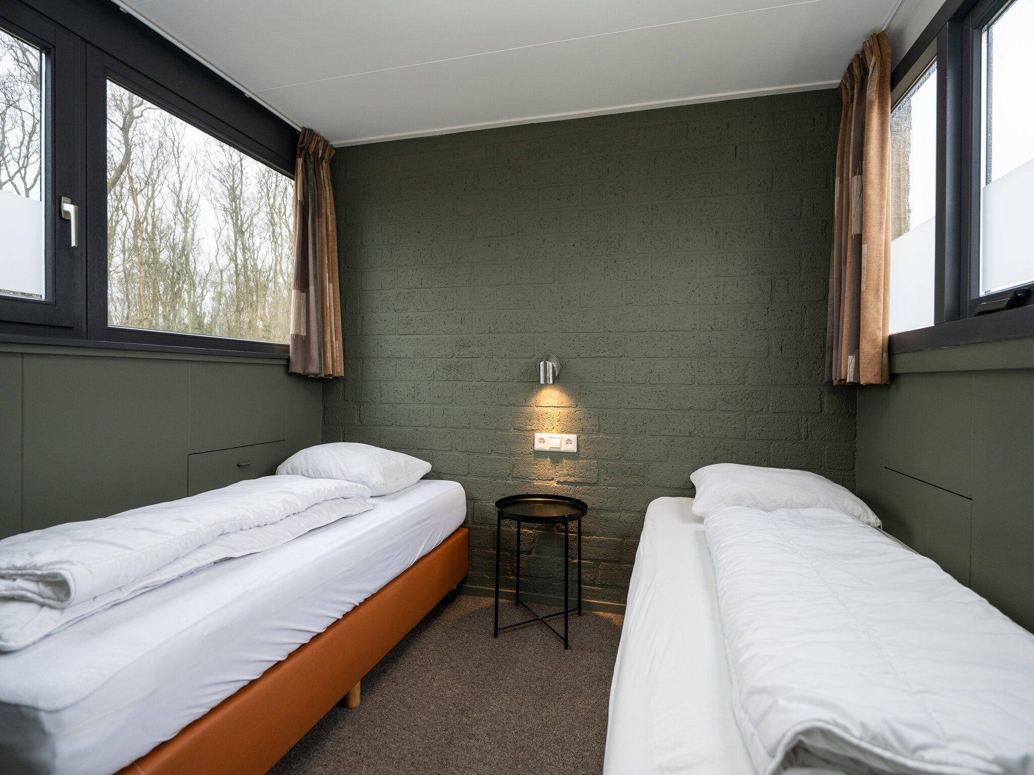 Een slaapkamer van Vakantiepark 't Eibernest Texel 3 in De Cocksdorp