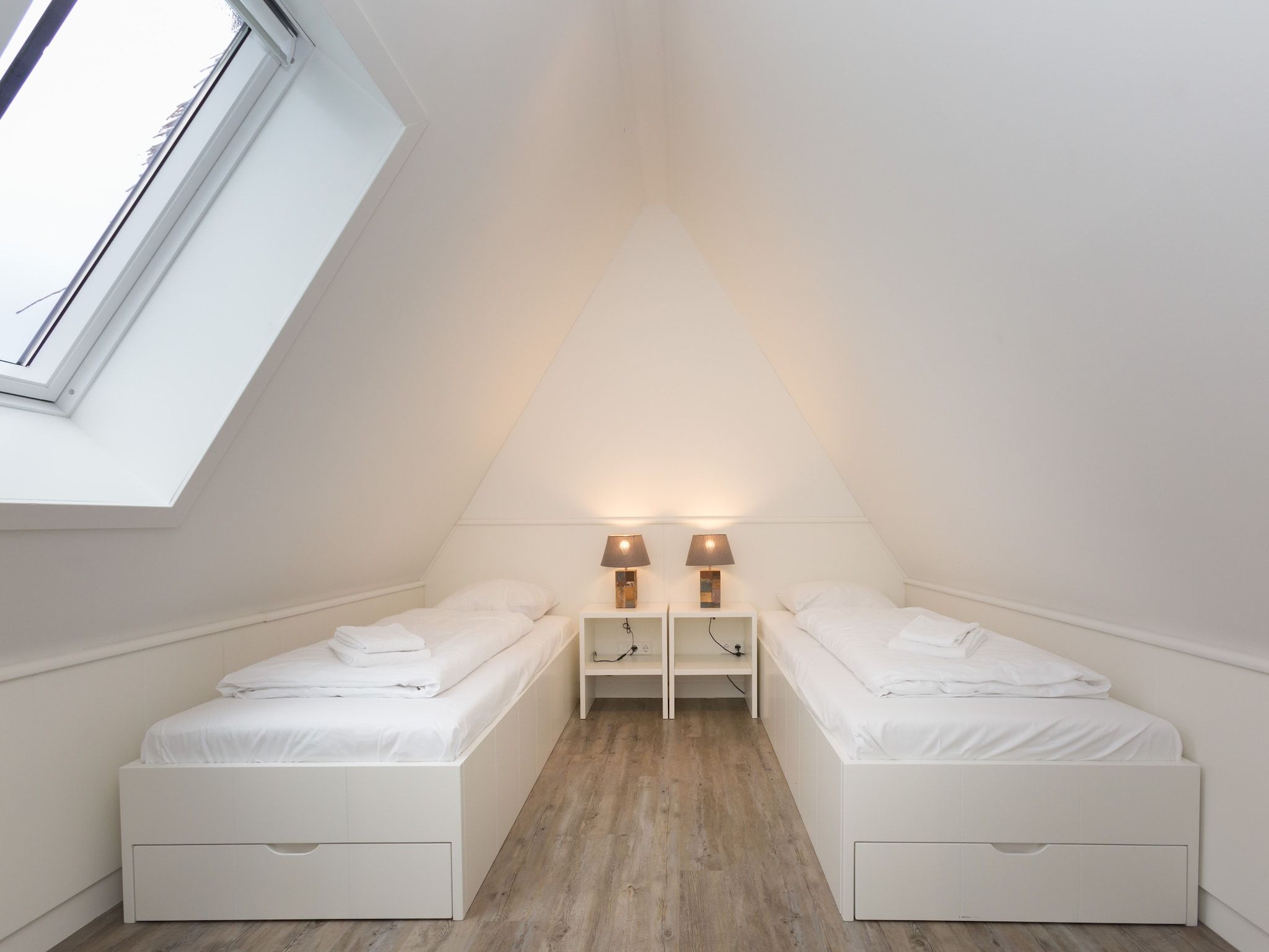 Een slaapkamer van Friese Meren Villa's 17 in Delfstrahuizen