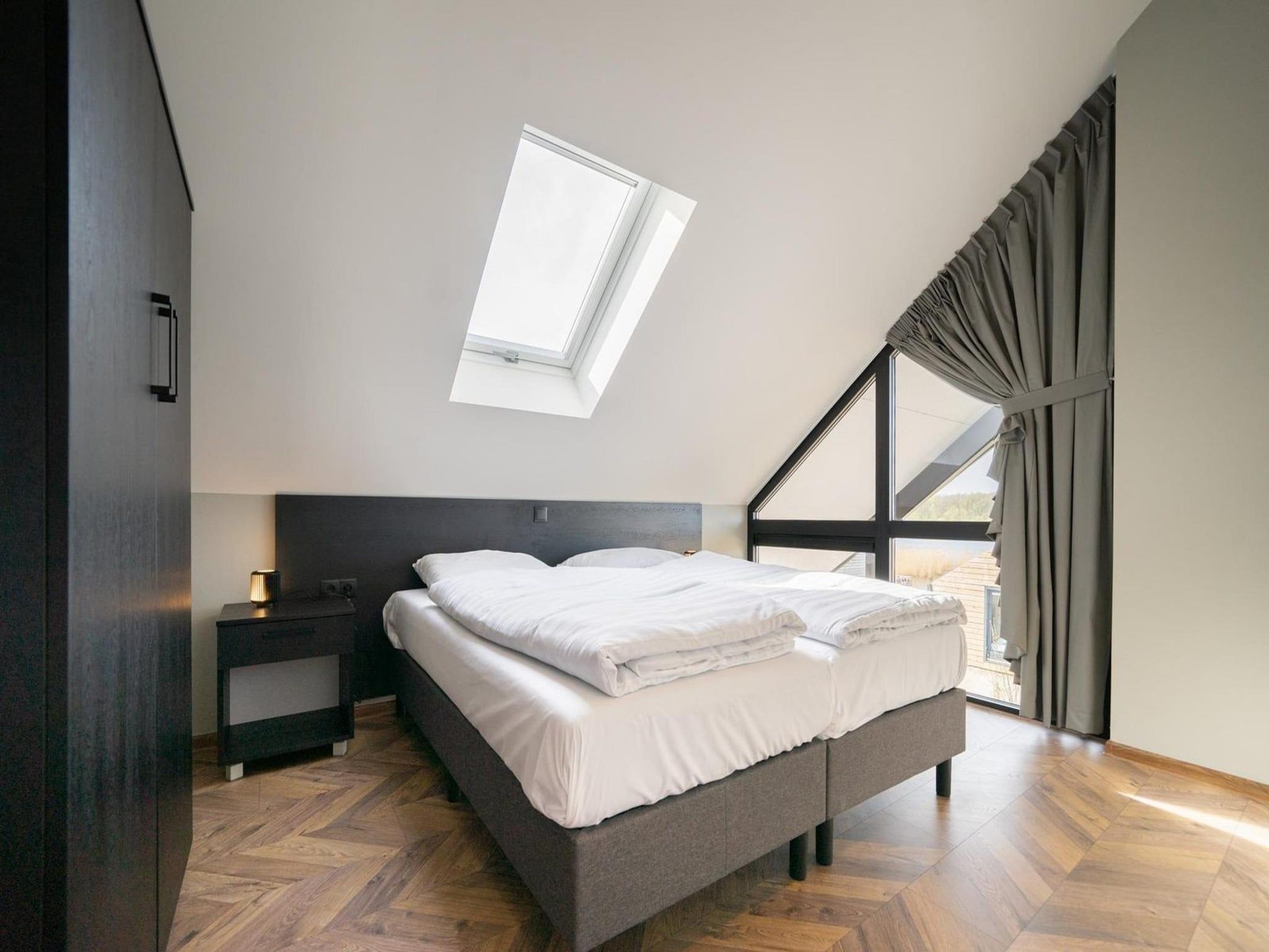 Een slaapkamer van Resort De IJssel Eilanden 8 in Kampen