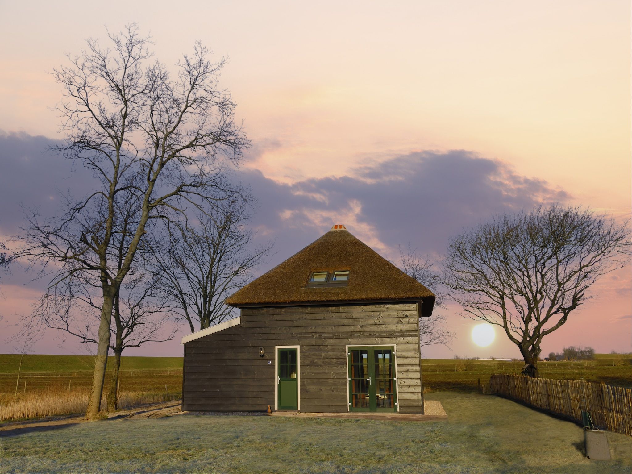 De buitenkant van Recreatiepark Wiringherlant - Wiringher Villa 23 in Hippolytushoef