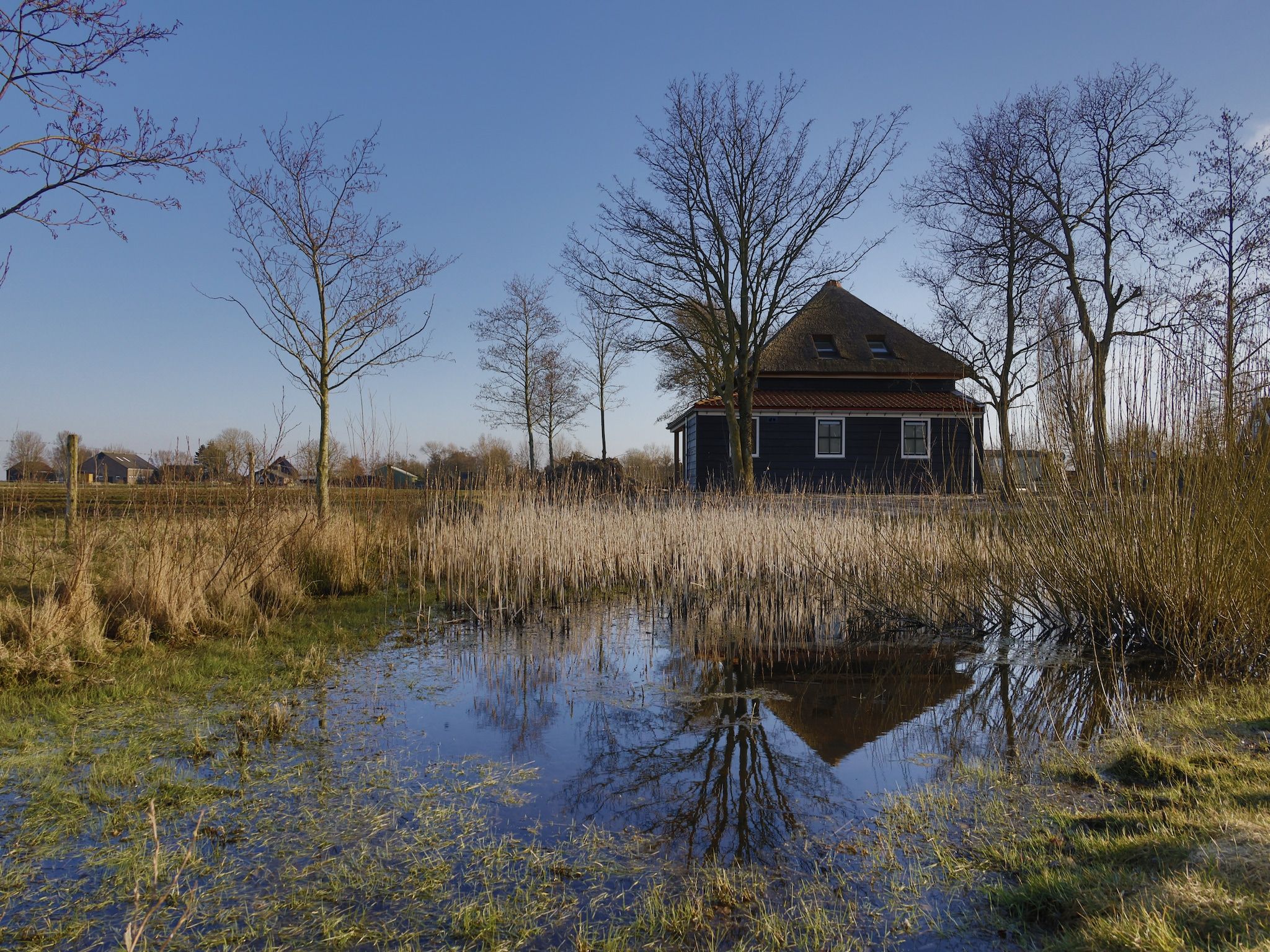 De buitenkant van Recreatiepark Wiringherlant - Wiringher Villa 23 in Hippolytushoef