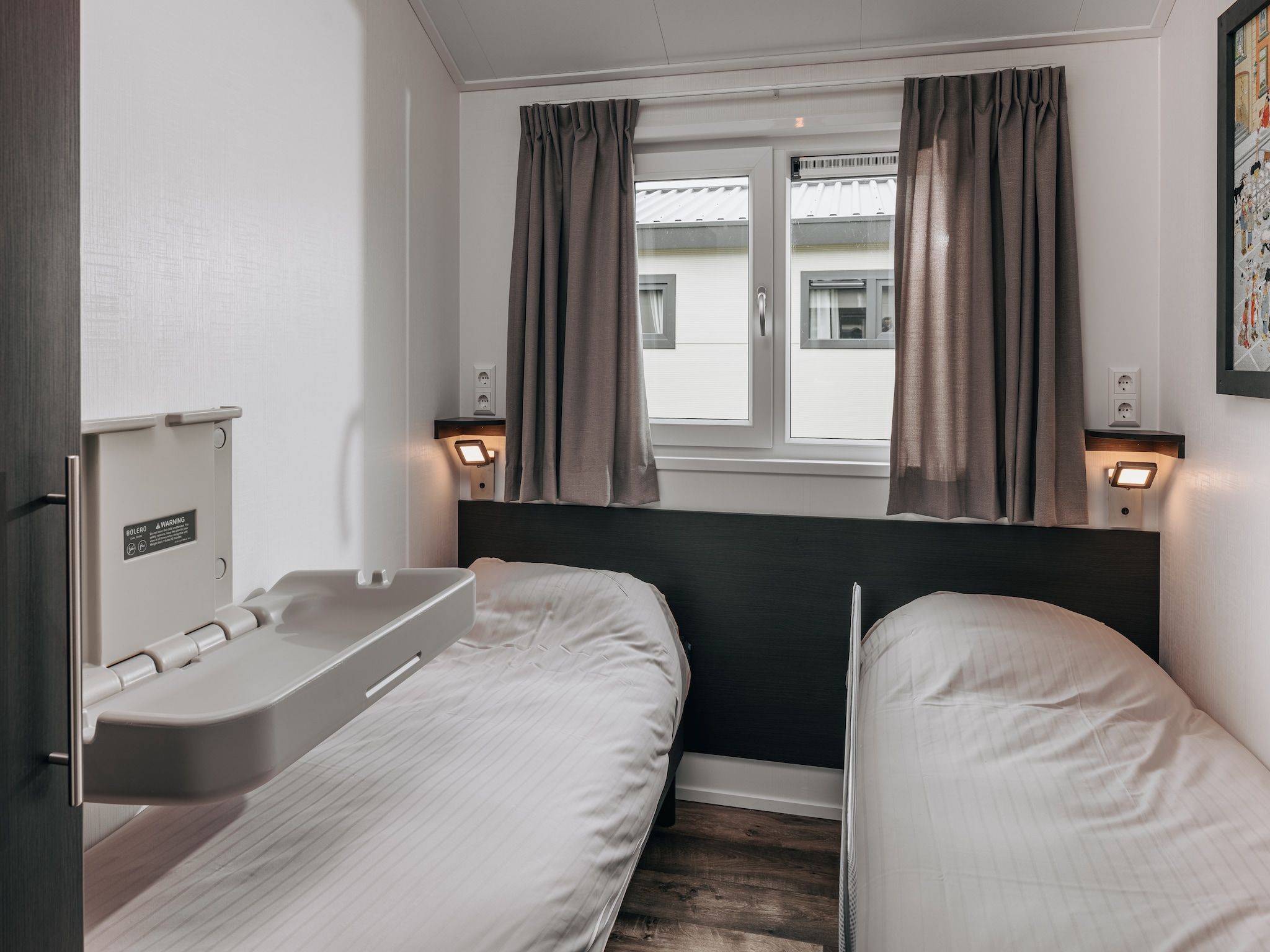 Een slaapkamer van Vakantiepark Giethoorn 8 in Giethoorn