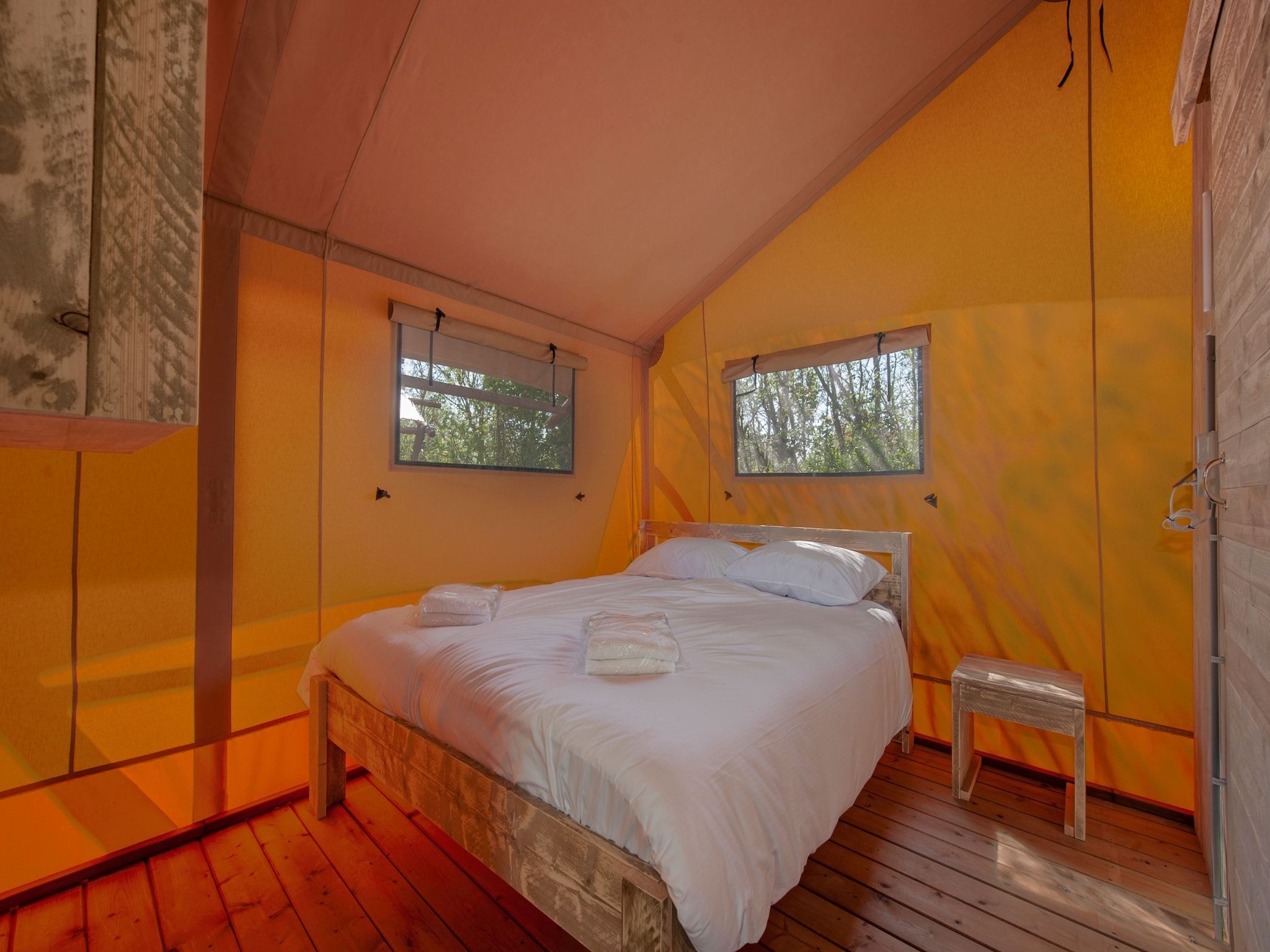 Een slaapkamer van Vakantiepark de Katjeskelder 22 in Oosterhout