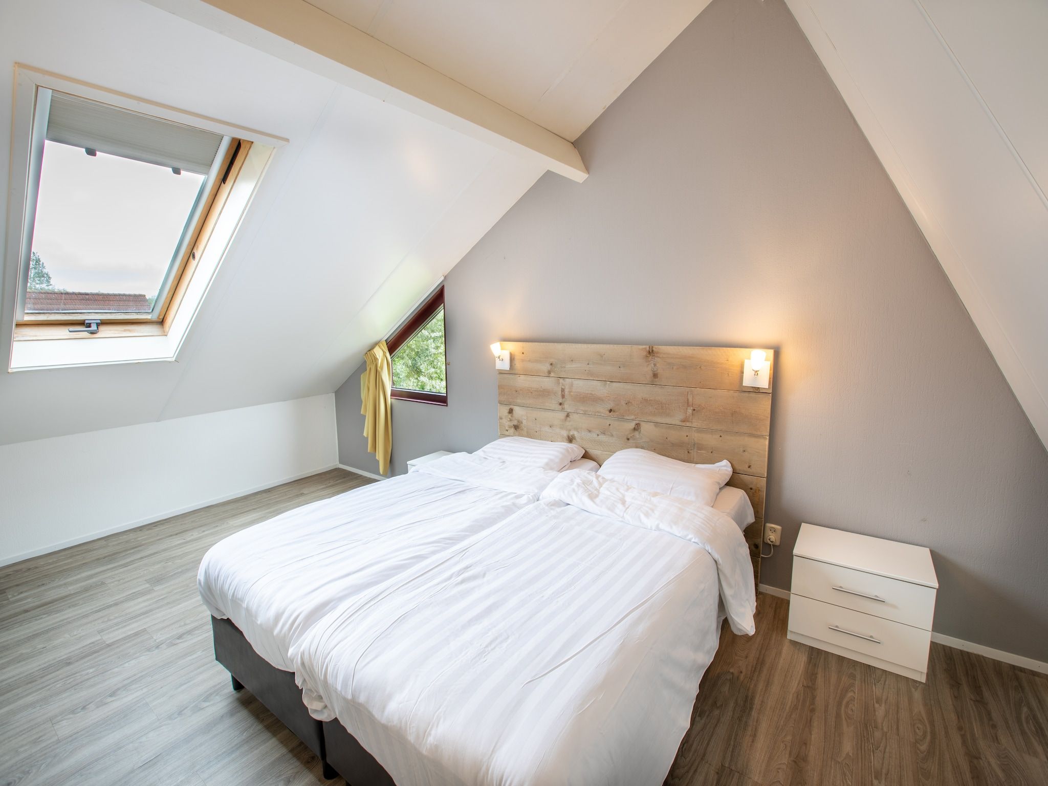 Een slaapkamer van Vakantiepark Hof van Zeeland 2 in Heinkenszand
