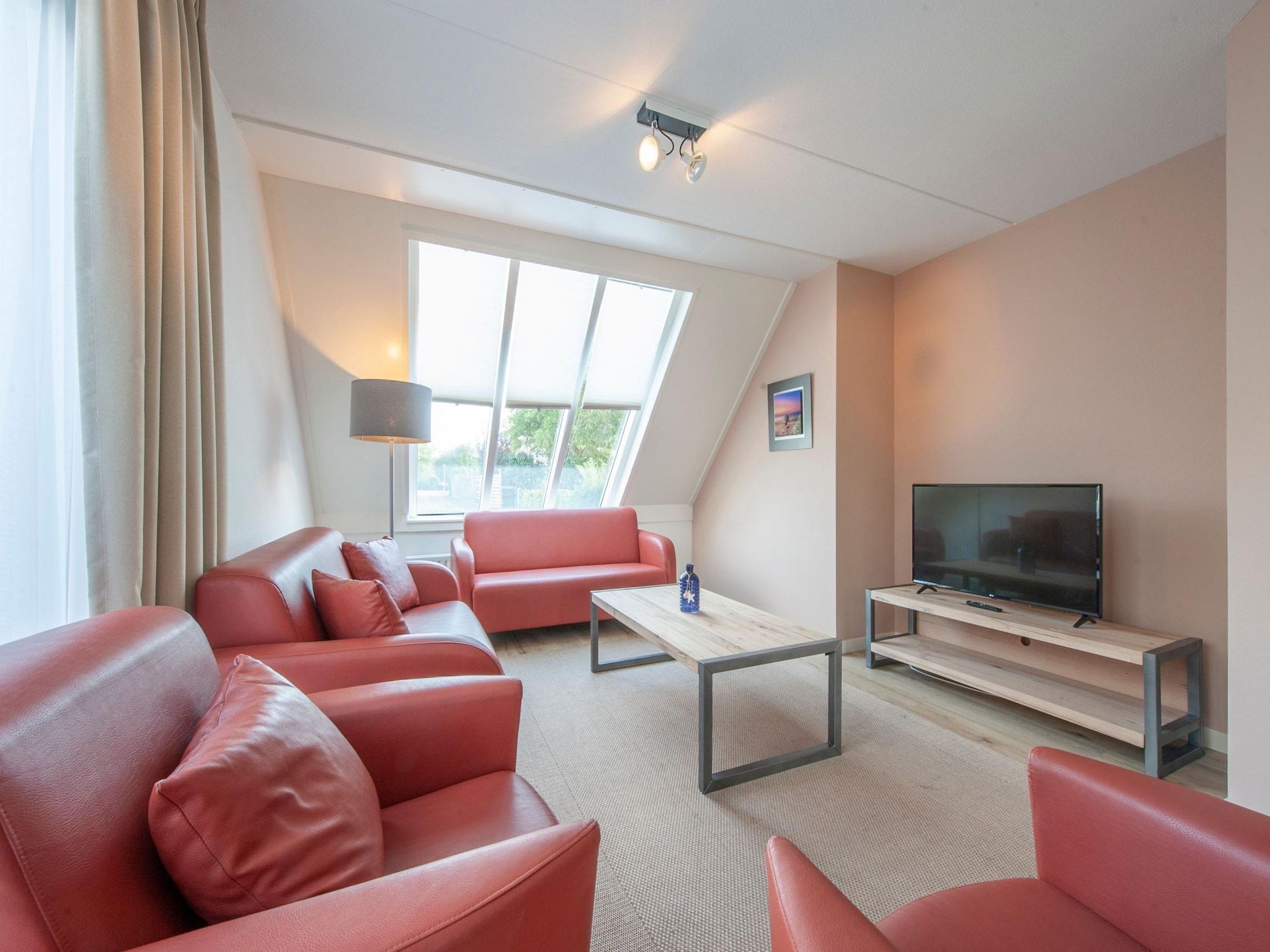 De woonkamer van Vakantiepark Zeeland Village 4 in Scharendijke