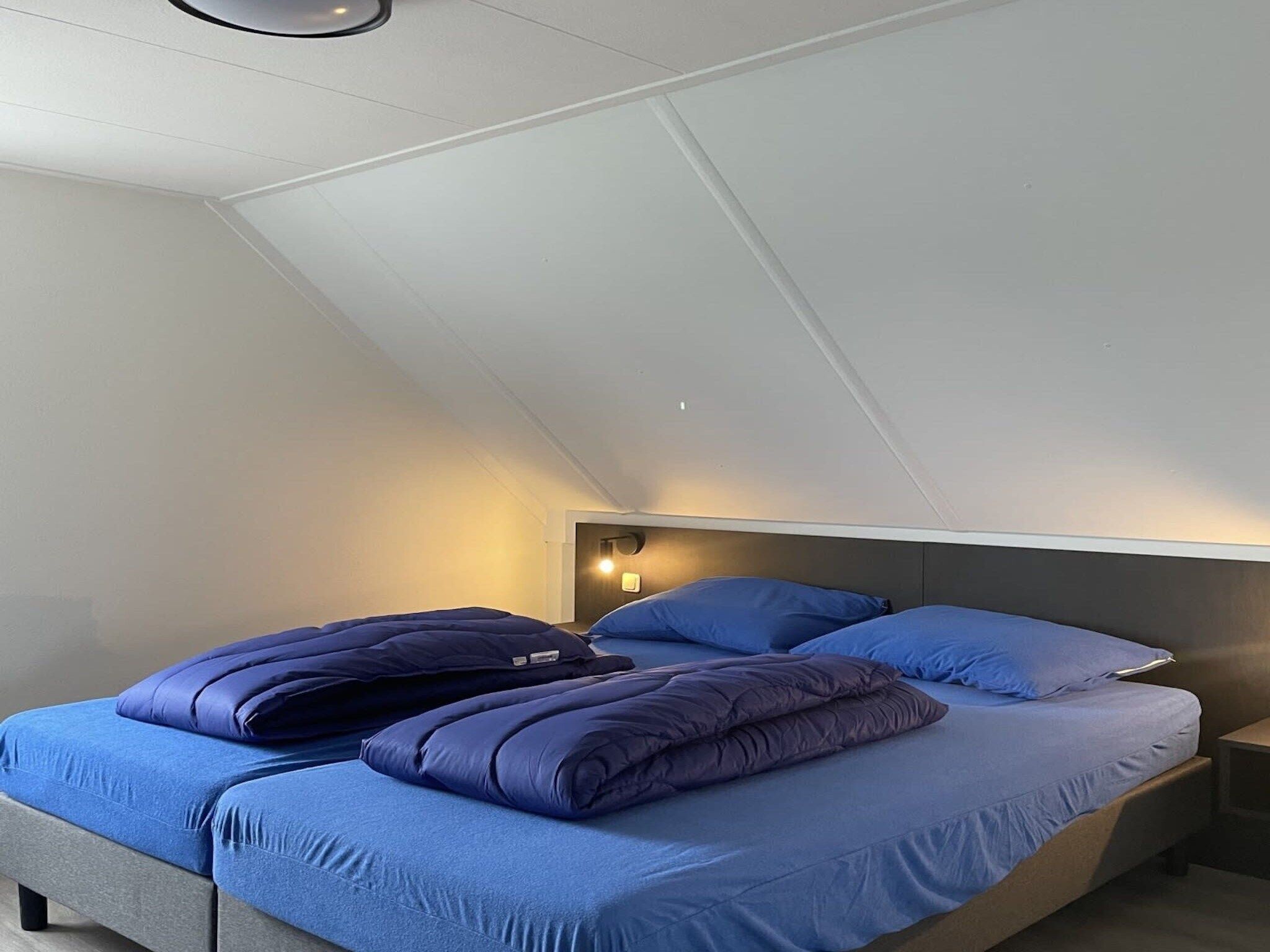 Een slaapkamer van Dijkvilla 6 in Medemblik
