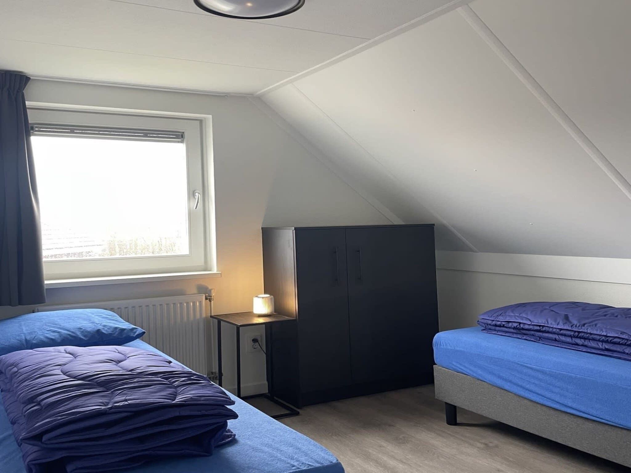 Een slaapkamer van Dijkvilla 6 in Medemblik