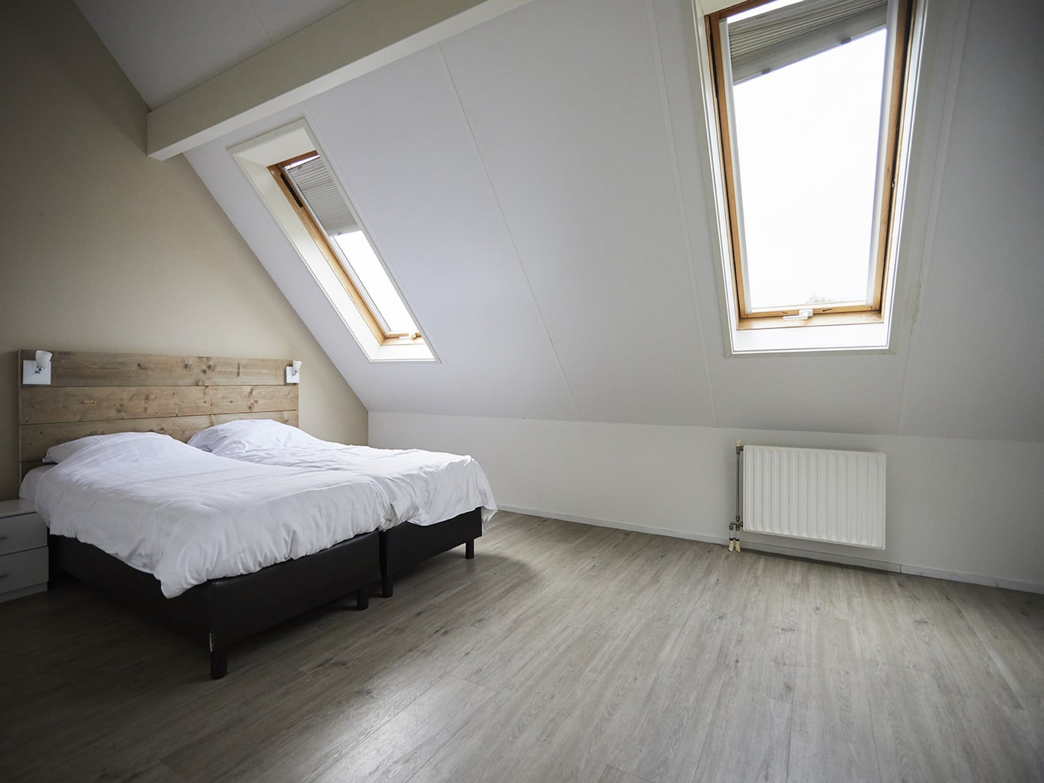 Een slaapkamer van Vakantiepark Hof van Zeeland  7 in Heinkenszand