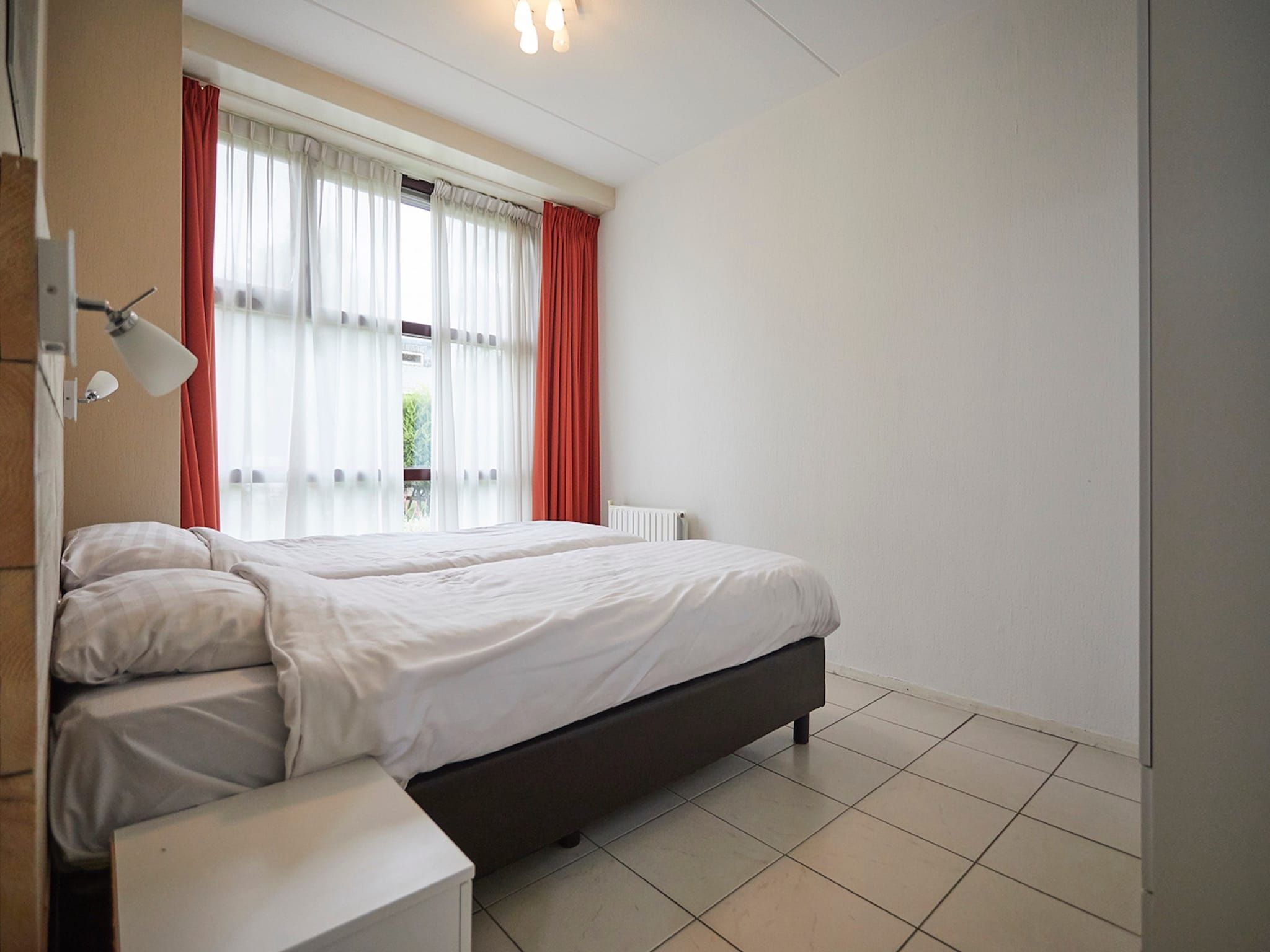 Een slaapkamer van Vakantiepark Hof van Zeeland  7 in Heinkenszand