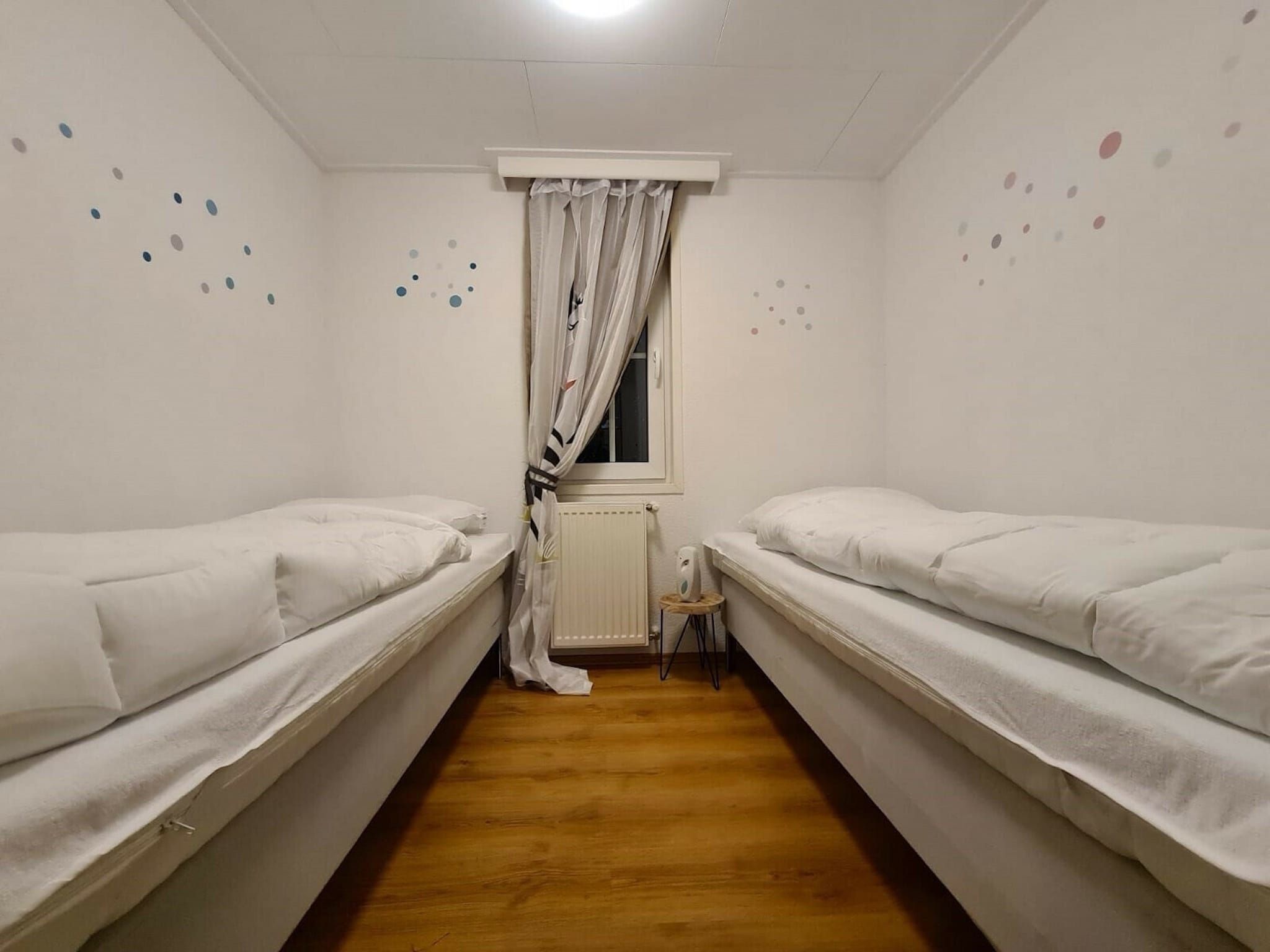 Een slaapkamer van Recreatiepark Rhederlaagse Meren 1 in Lathum