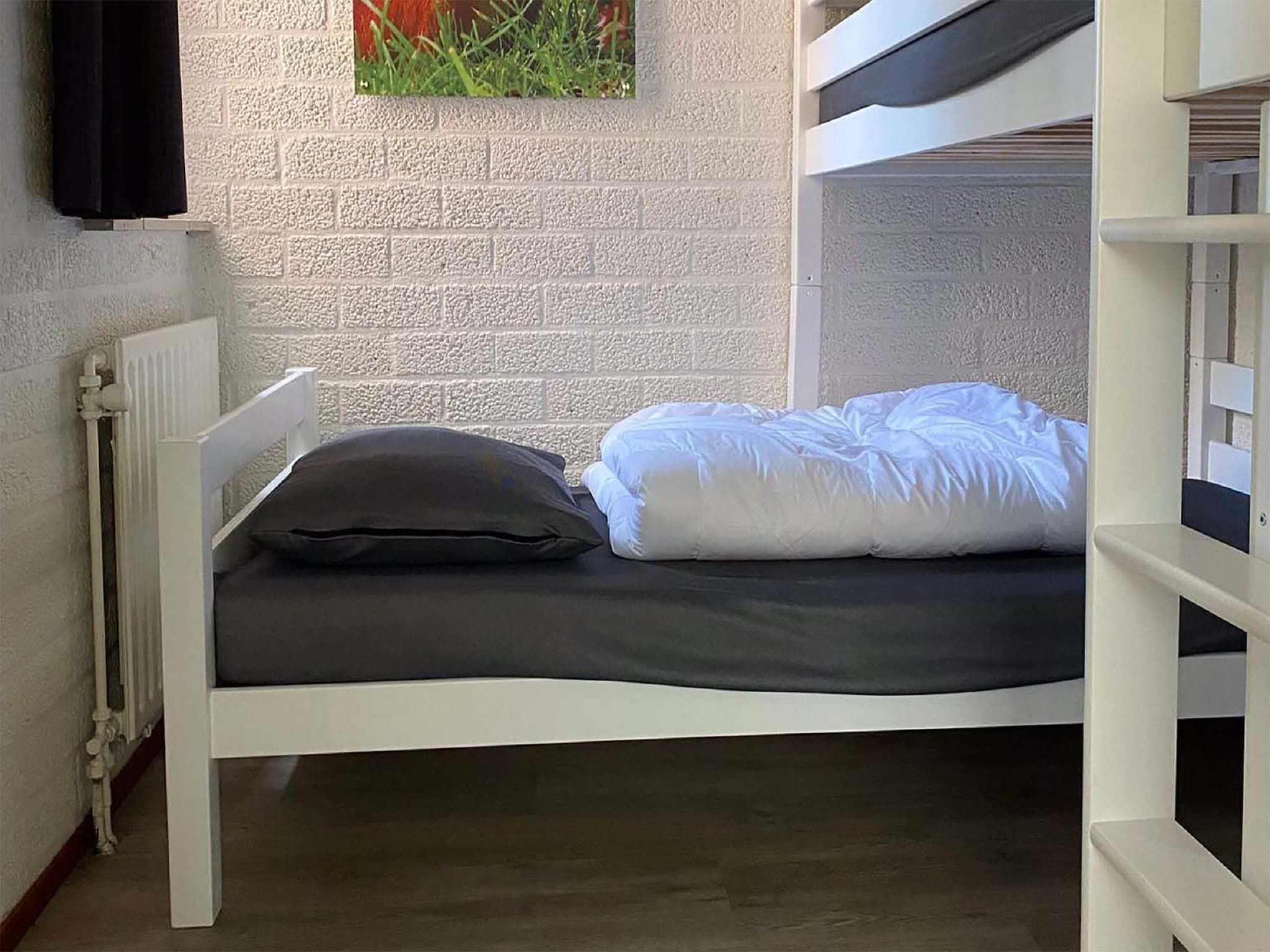 Een slaapkamer van Vakantiepark Weerterbergen 15 in Weert