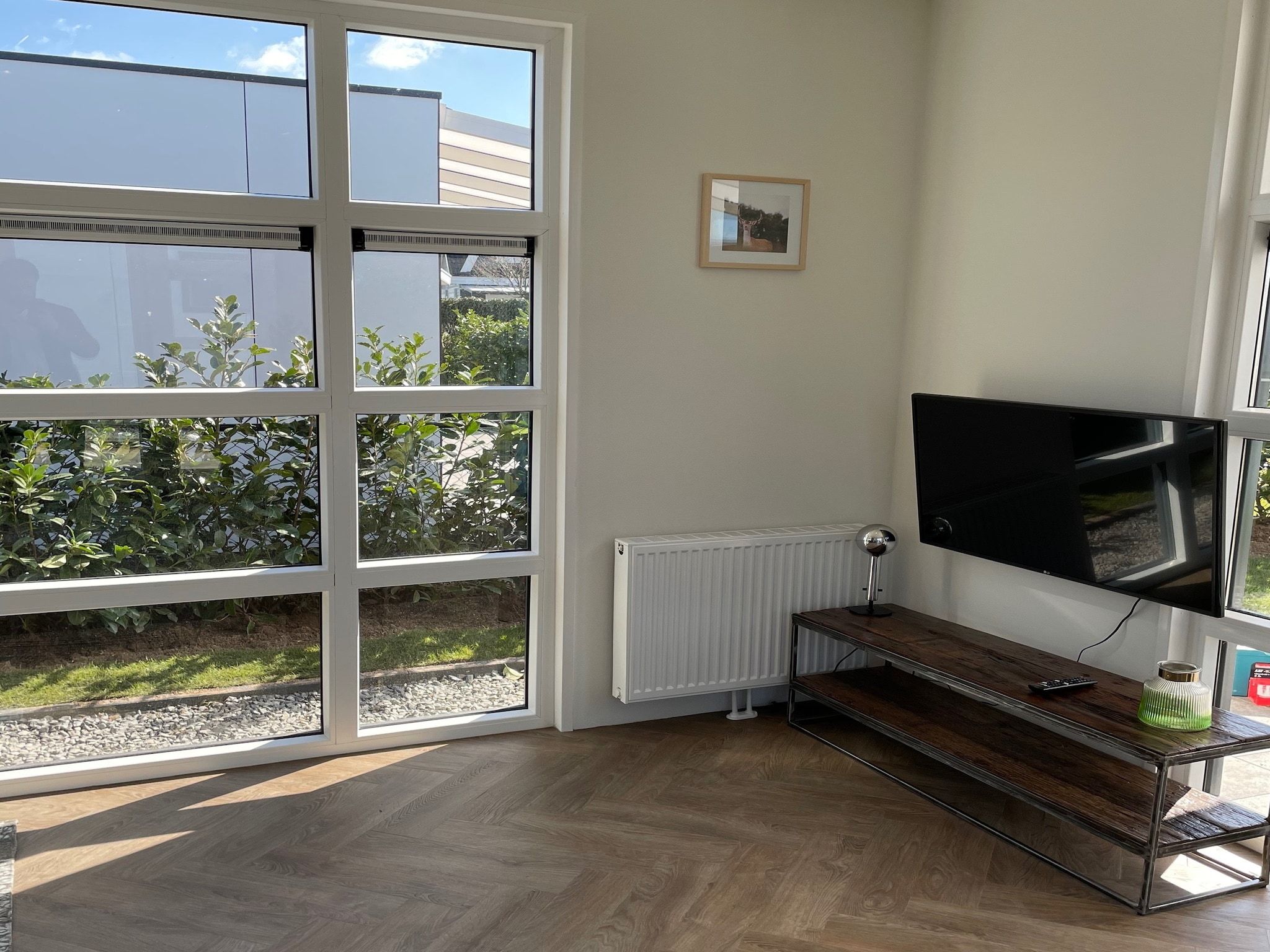 De woonkamer van Recreatiepark Rhederlaagse Meren 9 in Lathum