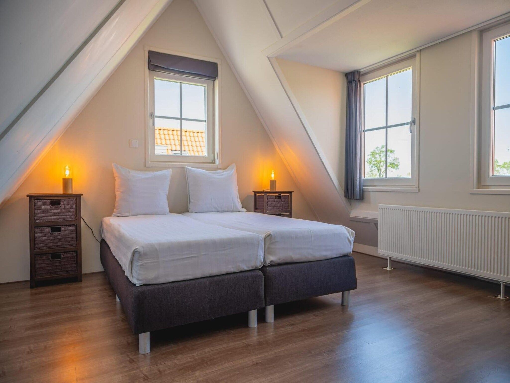 Een slaapkamer van 	De Rijp met Sauna  6 personen in West-Graftdijk