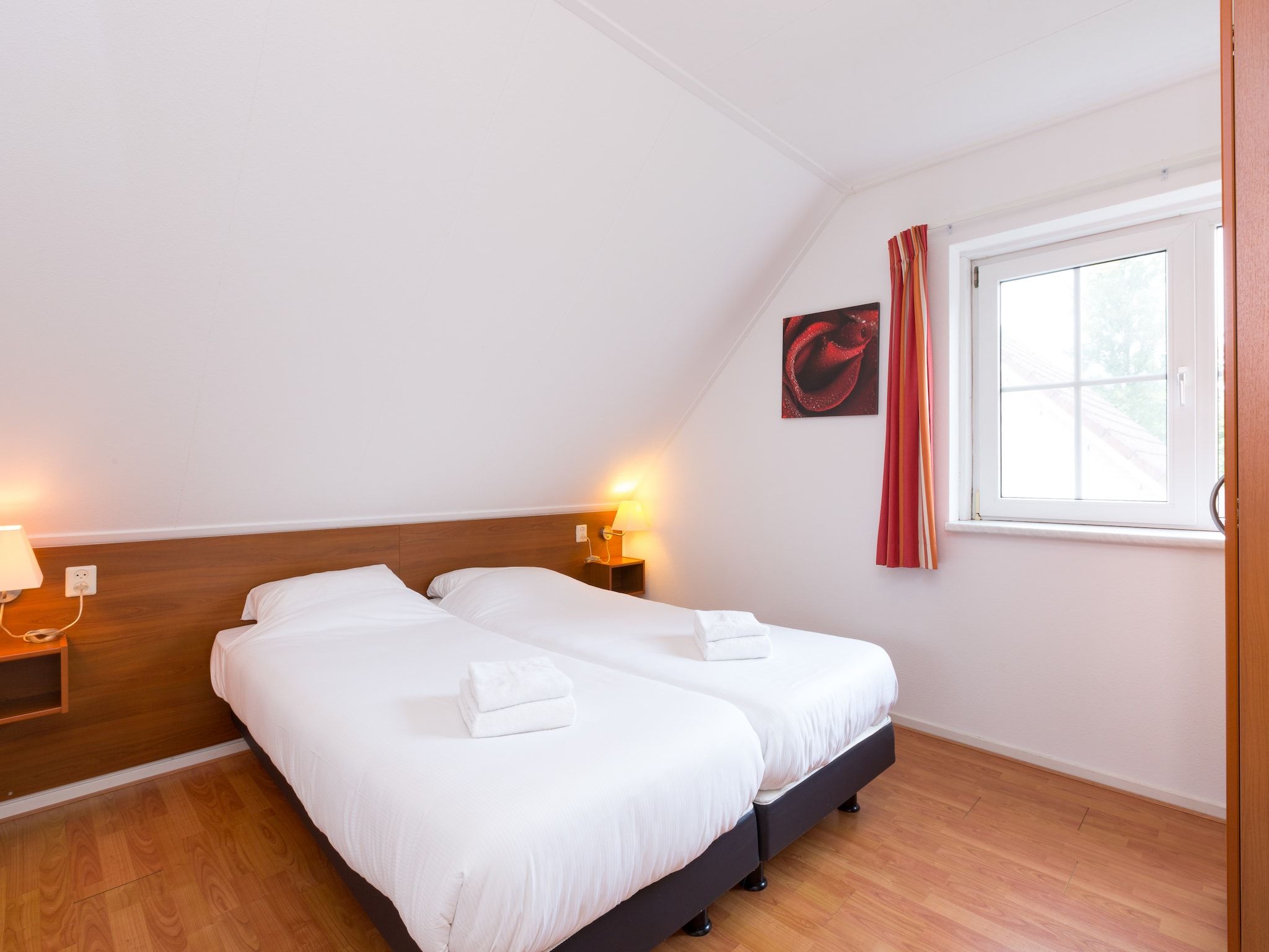 Een slaapkamer van Vakantiepark Hellendoorn 1 in Hellendoorn