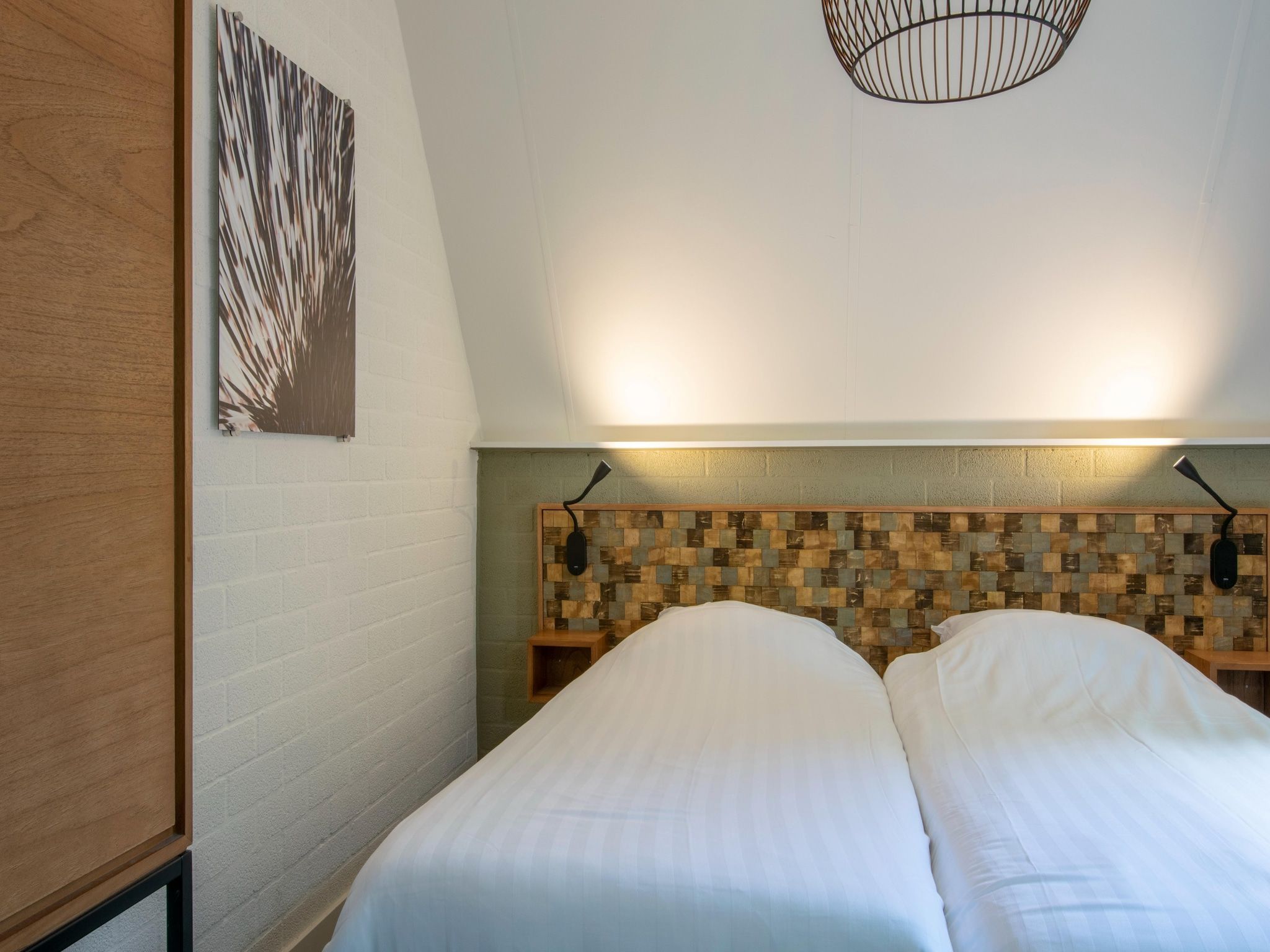 Een slaapkamer van Vakantiepark de Katjeskelder 23 in Oosterhout