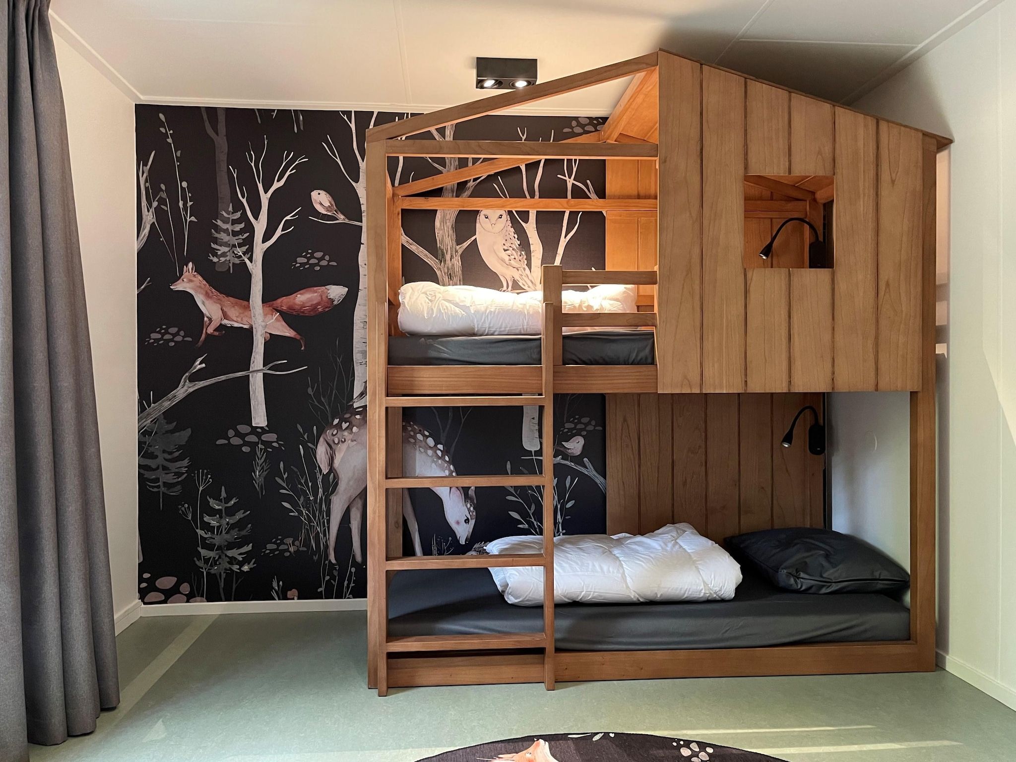 Een slaapkamer van Vakantiepark de Katjeskelder 23 in Oosterhout