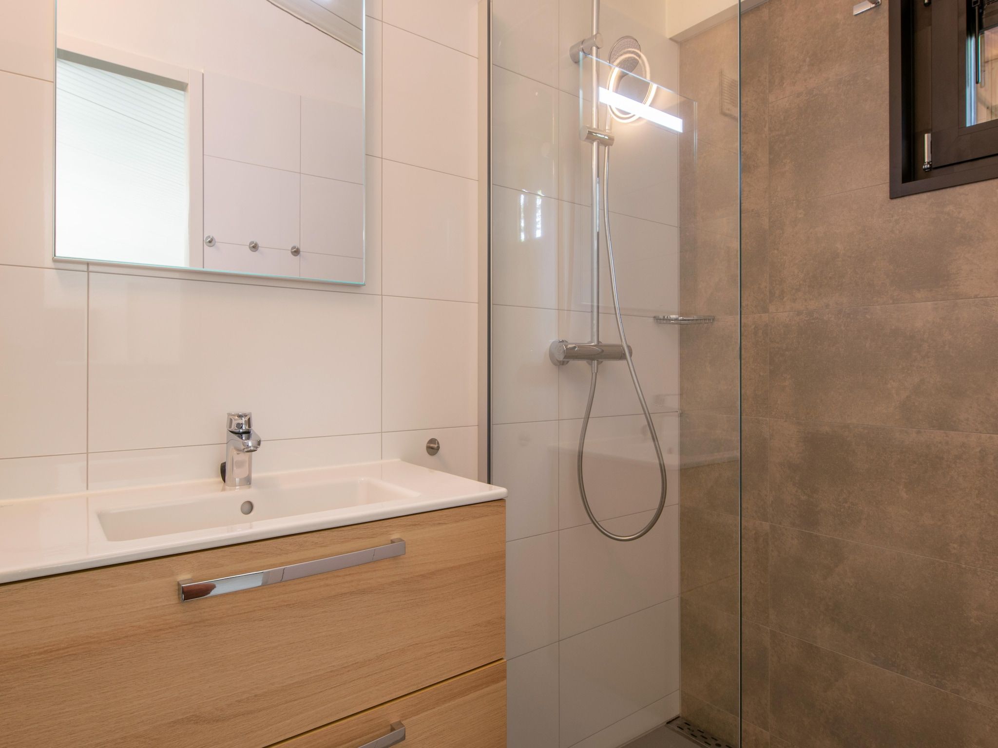 De badkamer van Bospark 't Wolfsven 16 in Mierlo