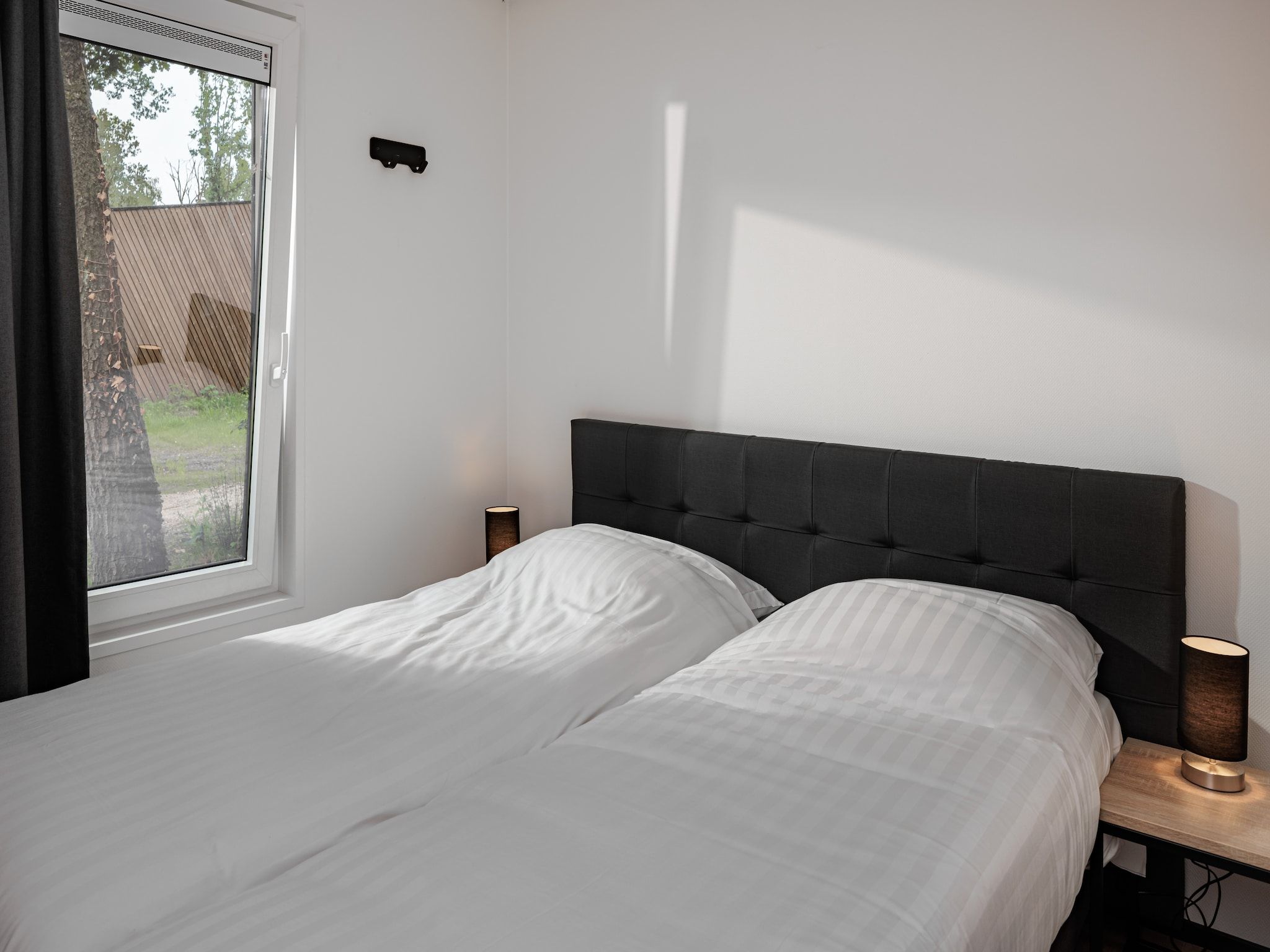 Een slaapkamer van Vakantiepark Schaijk 8 in Schaijk