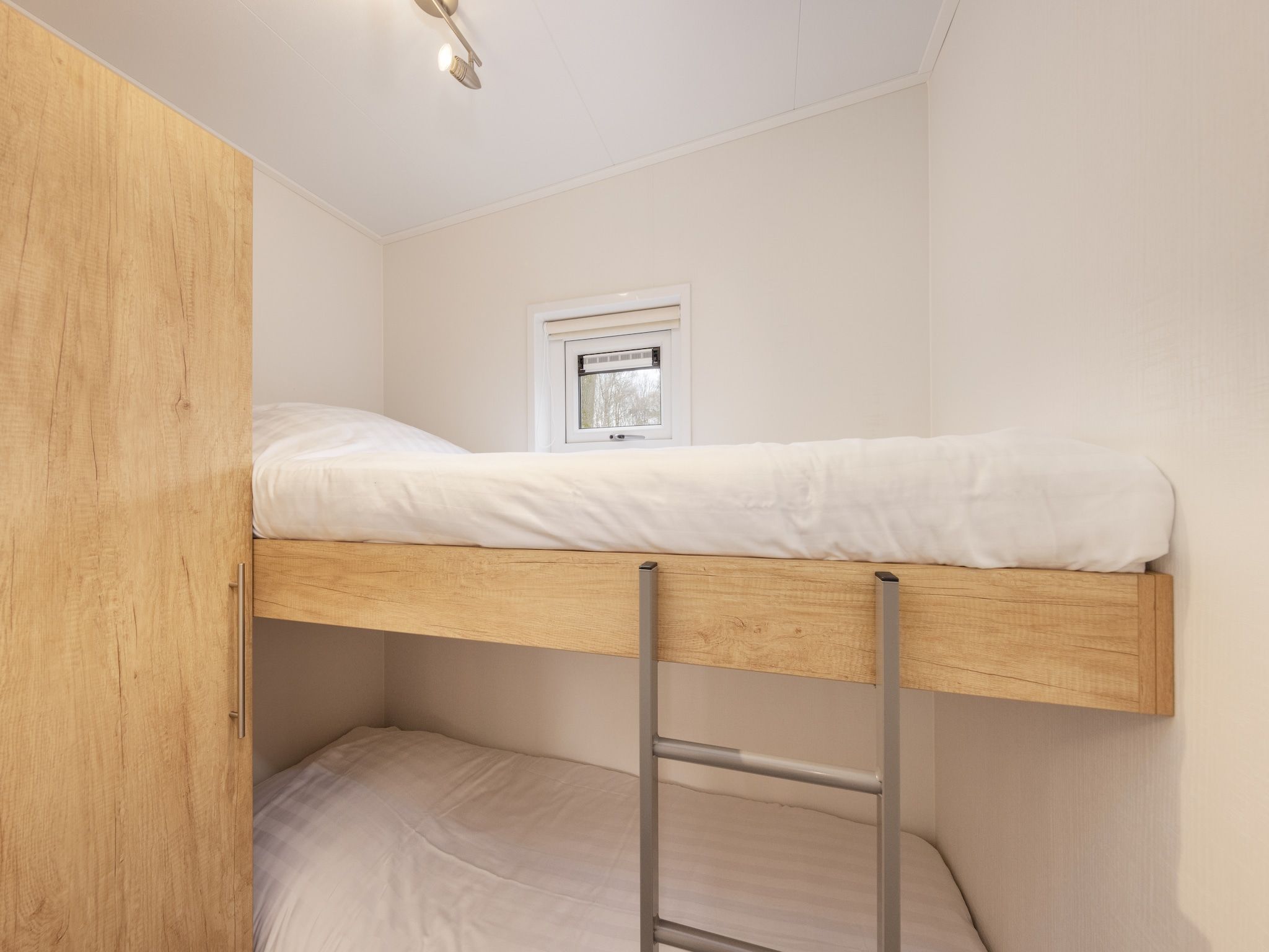 Een slaapkamer van Recreatiepark Tolplas 20 in Hoge Hexel