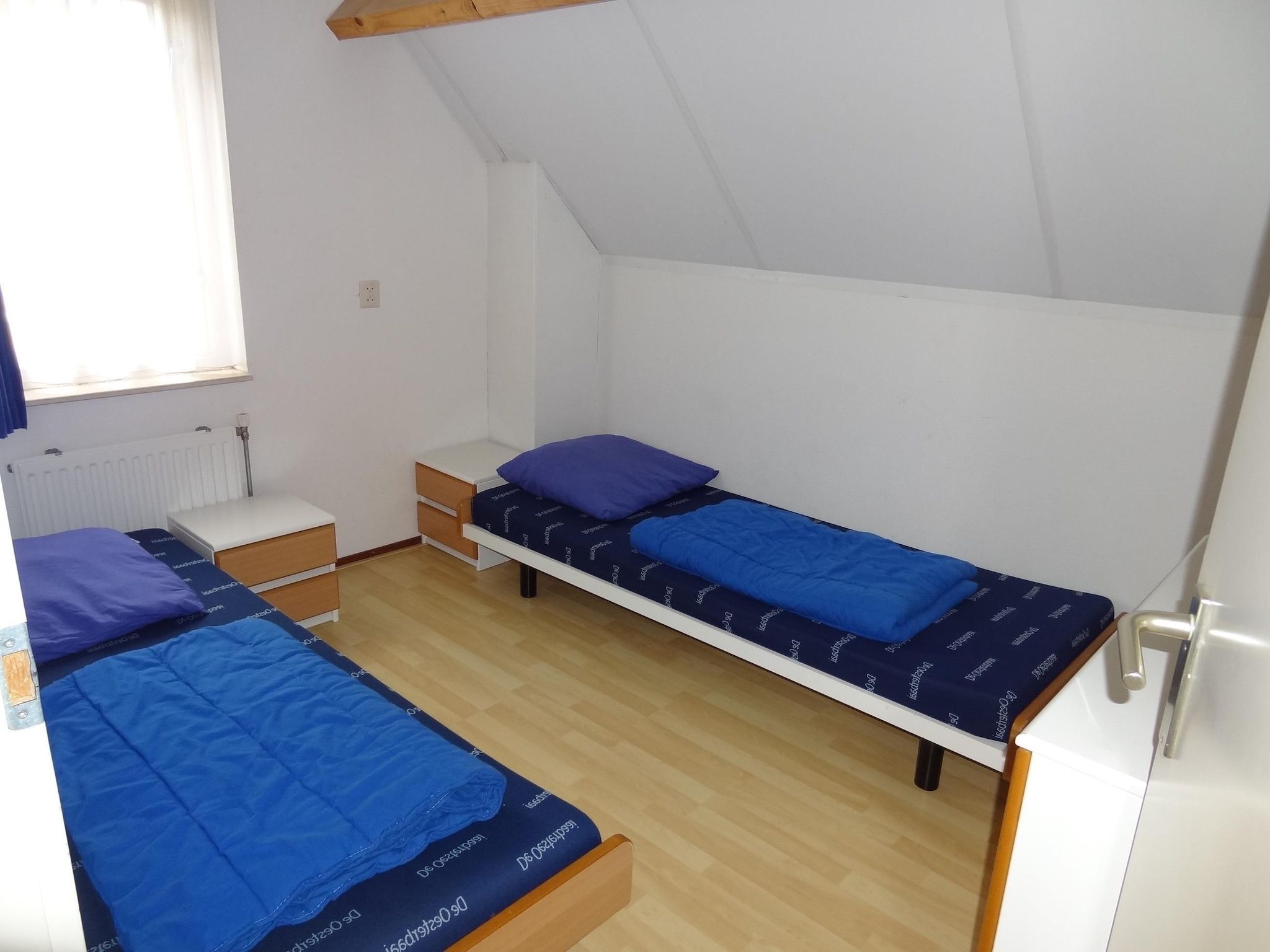 Een slaapkamer van Villapark De Oesterbaai 15 in Wemeldinge