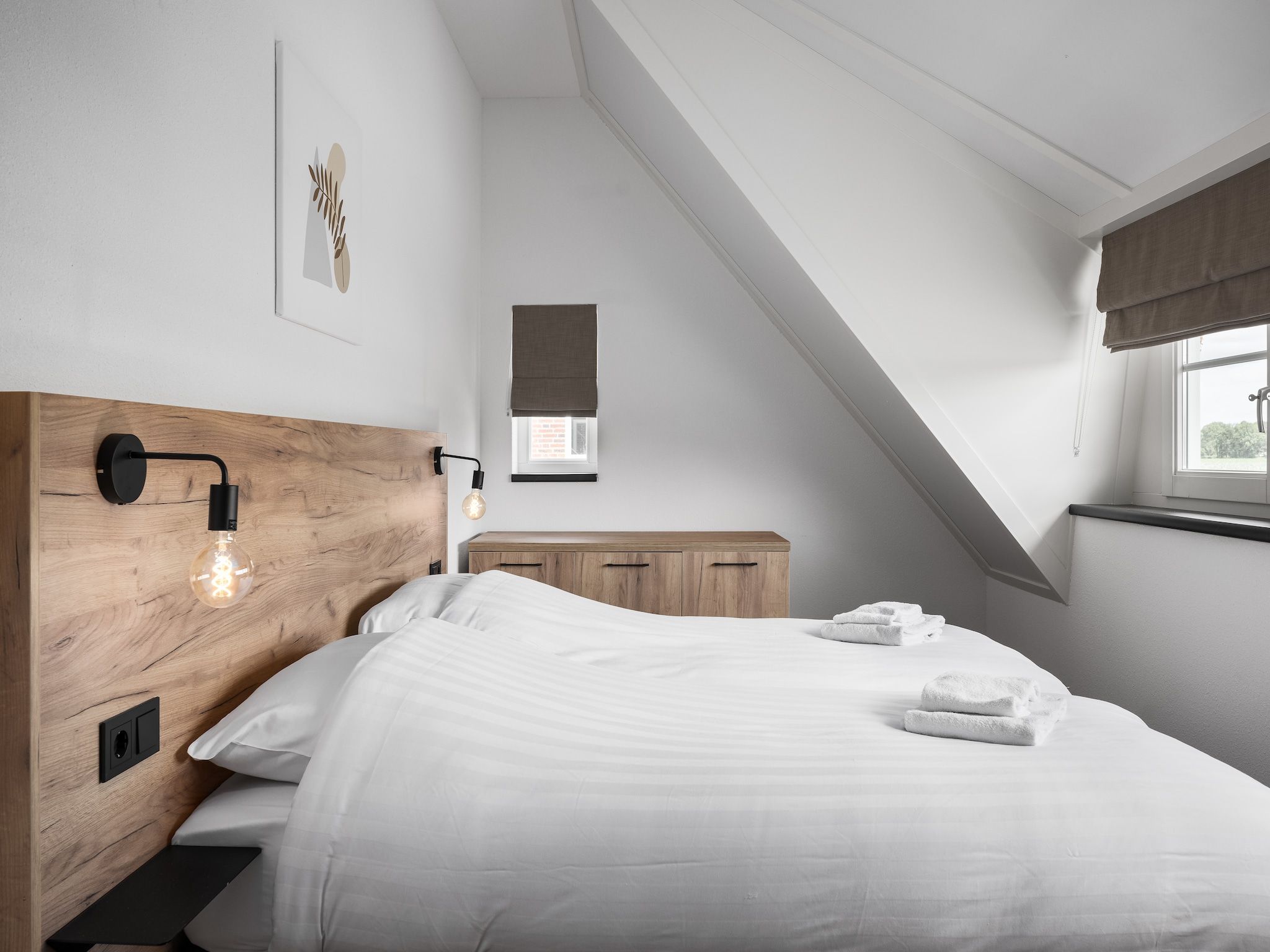 Een slaapkamer van Vakantiepark De Heihorsten 8 in Someren