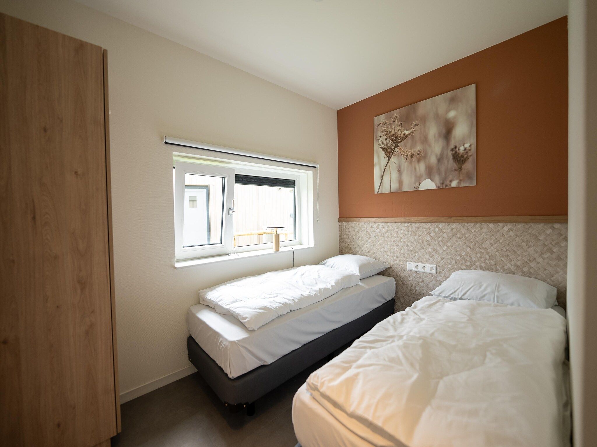 Een slaapkamer van Vakantiepark Zeebad 14 in Breskens