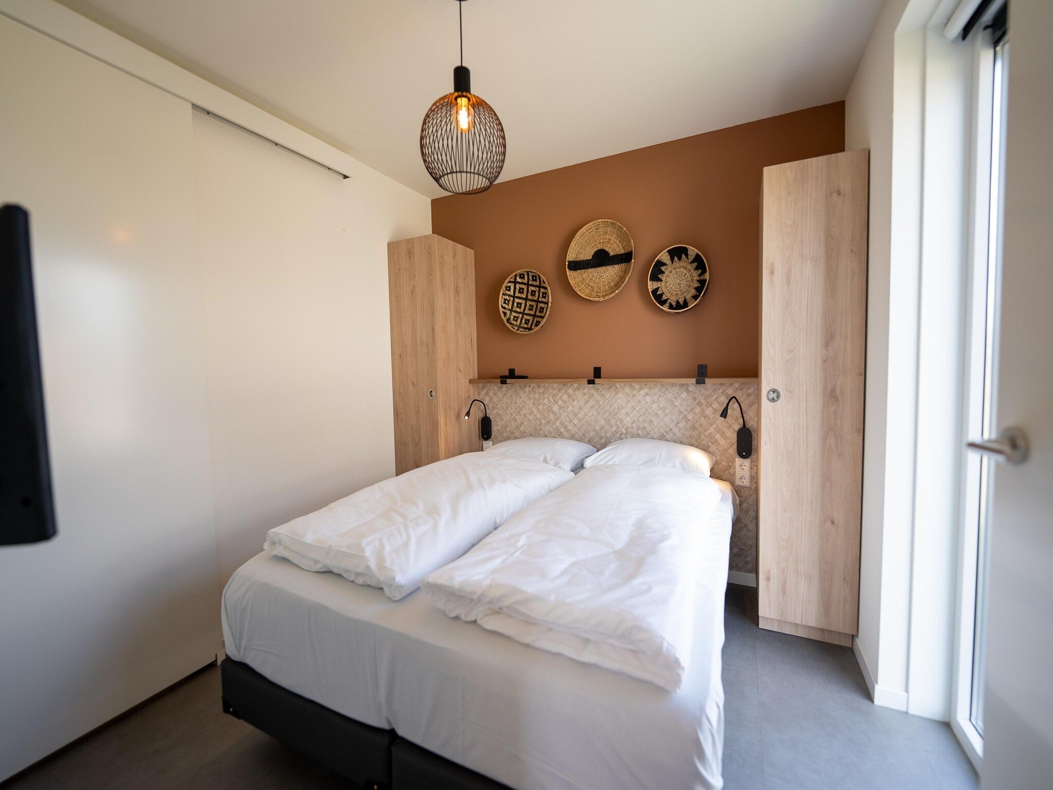 Een slaapkamer van Vakantiepark Zeebad 15 in Breskens