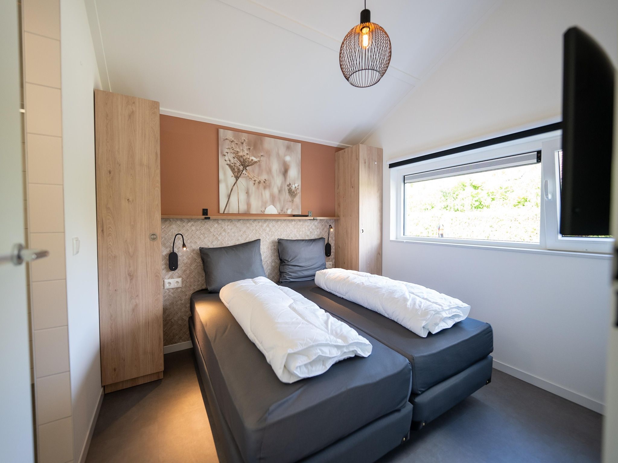 Een slaapkamer van Vakantiepark Zeebad 19 in Breskens