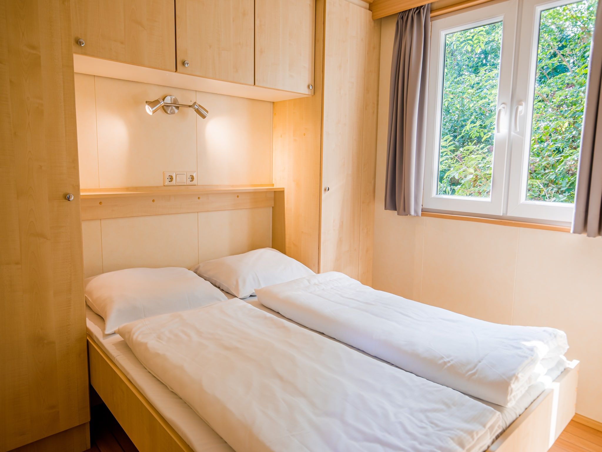 Een slaapkamer van Vakantiepark Leukermeer 1 in Well