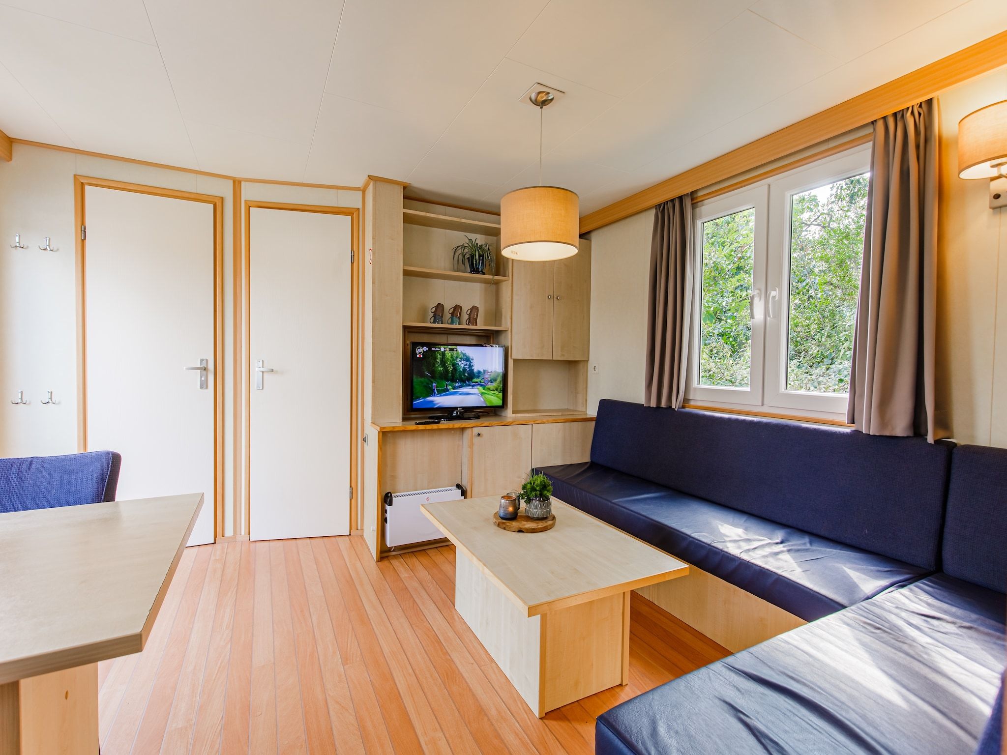 De woonkamer van Vakantiepark Leukermeer 6 in Well