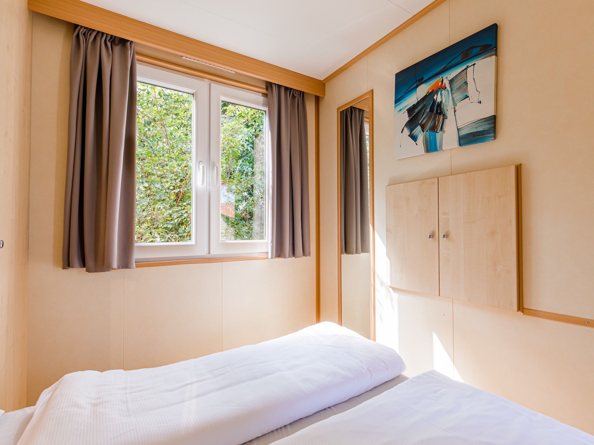 Een slaapkamer van Vakantiepark Leukermeer 6 in Well