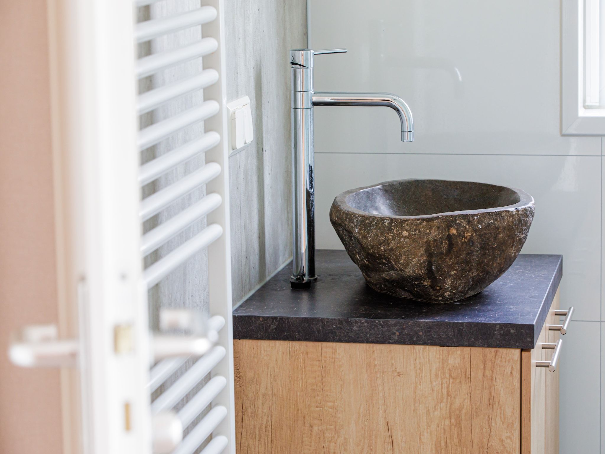 De badkamer van Vakantiepark Leukermeer 9 in Well