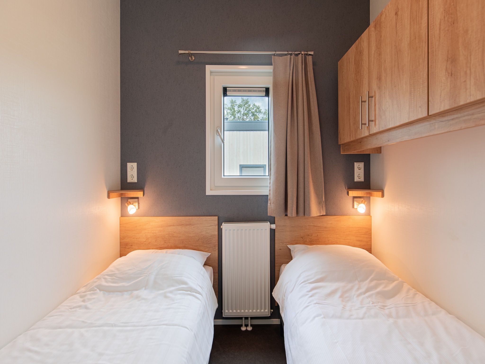 Een slaapkamer van Vakantiepark Leukermeer 10 in Well