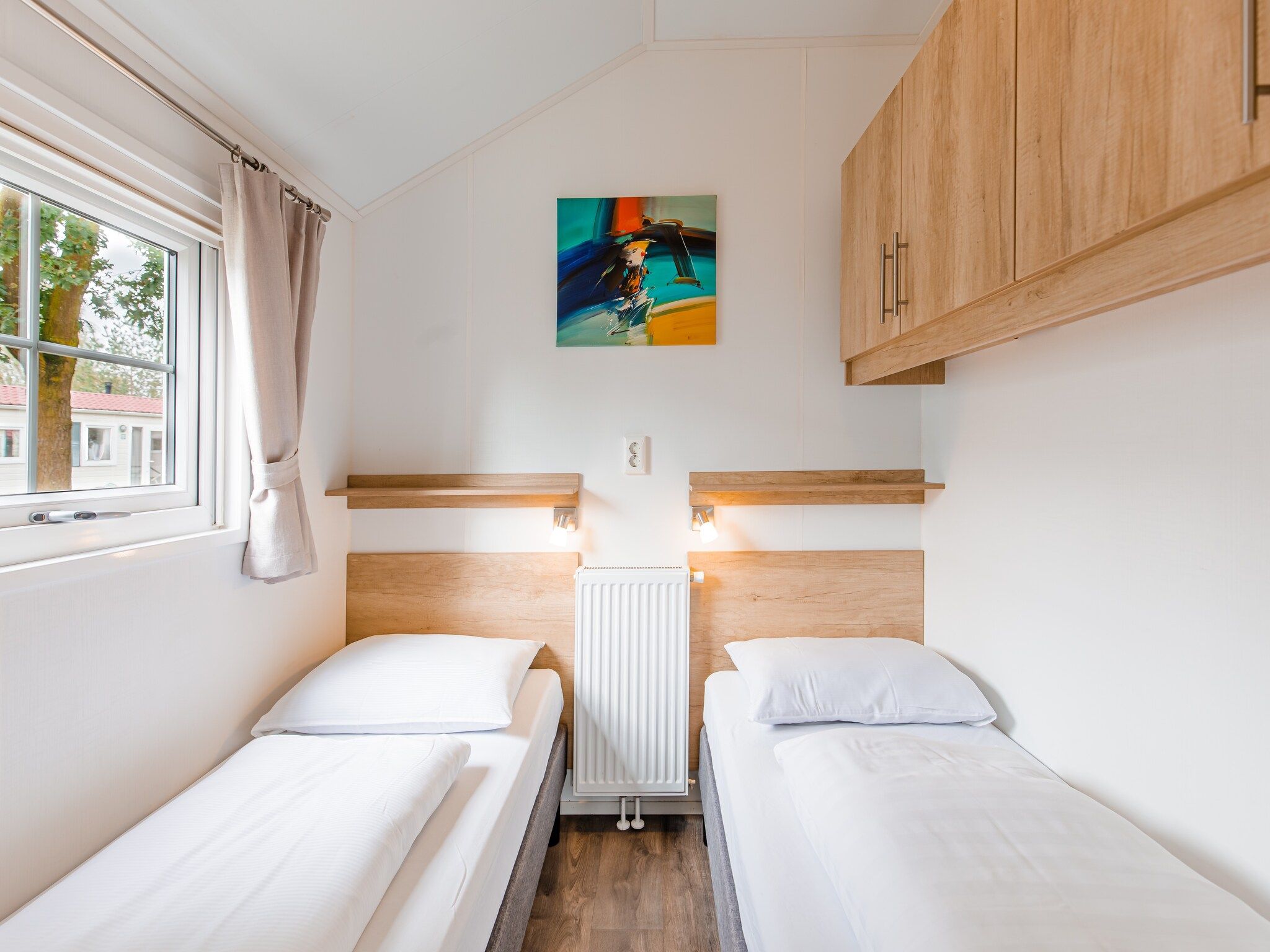 Een slaapkamer van Vakantiepark Leukermeer 11 in Well