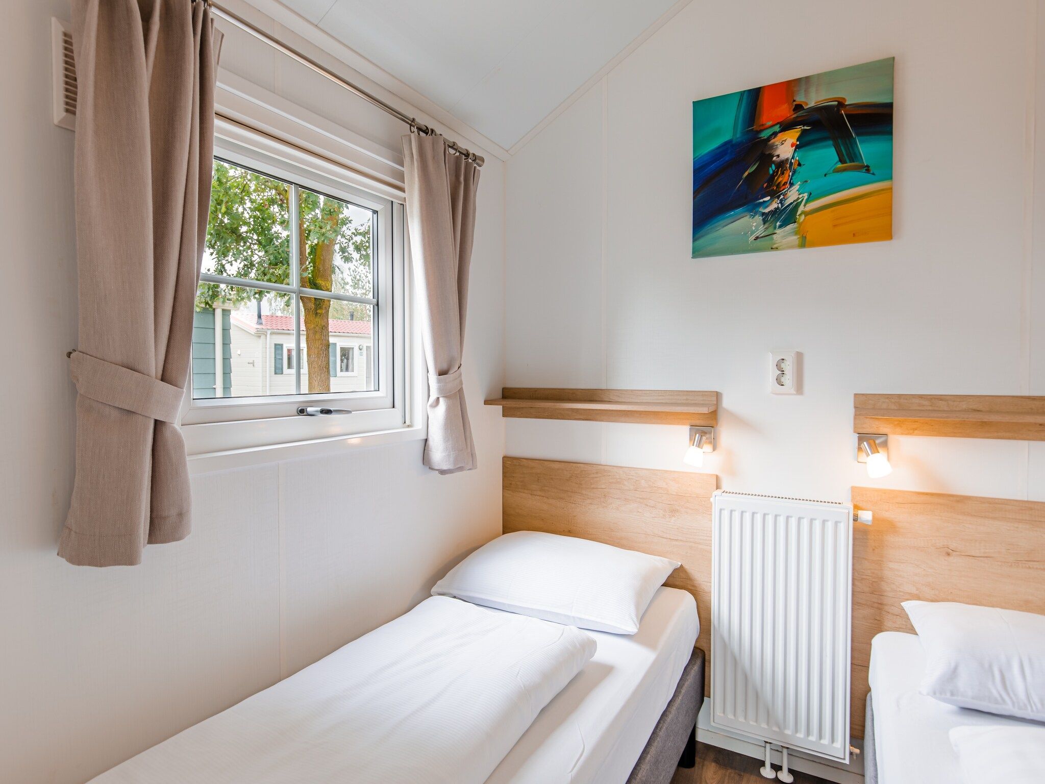 Een slaapkamer van Vakantiepark Leukermeer 11 in Well