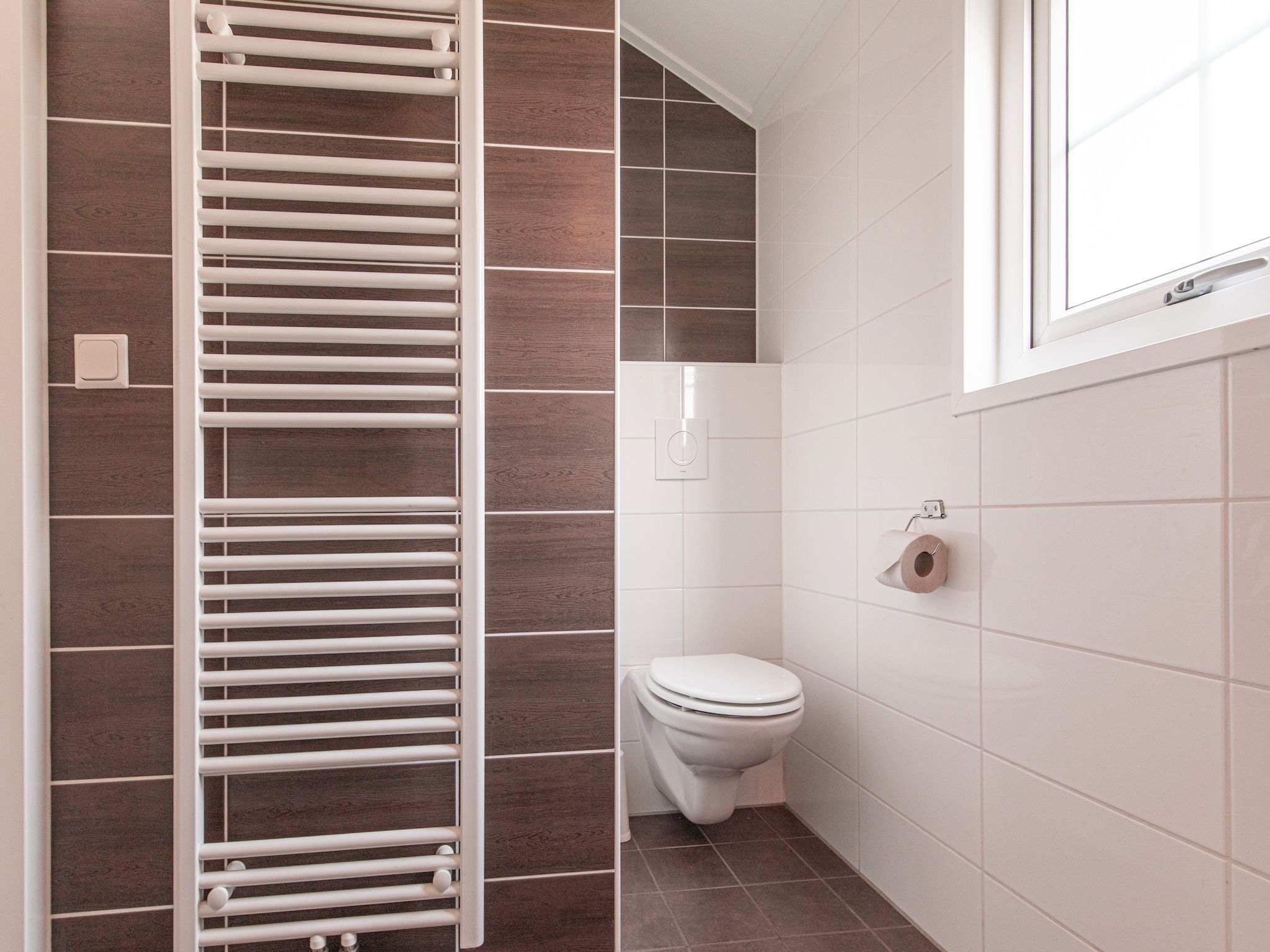 De badkamer van Vakantiepark Leukermeer 12 in Well