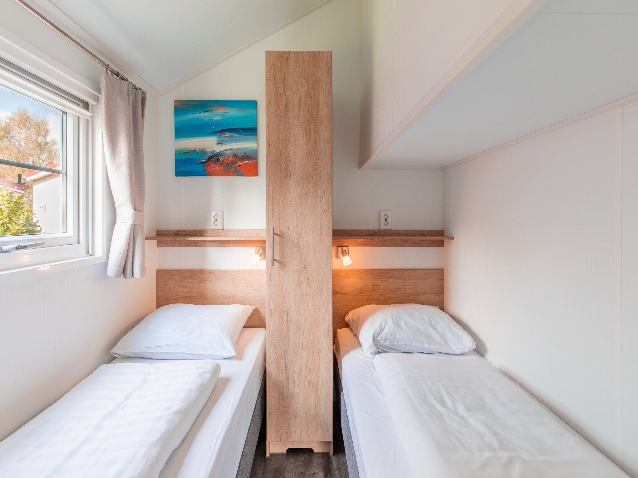 Een slaapkamer van Vakantiepark Leukermeer 12 in Well