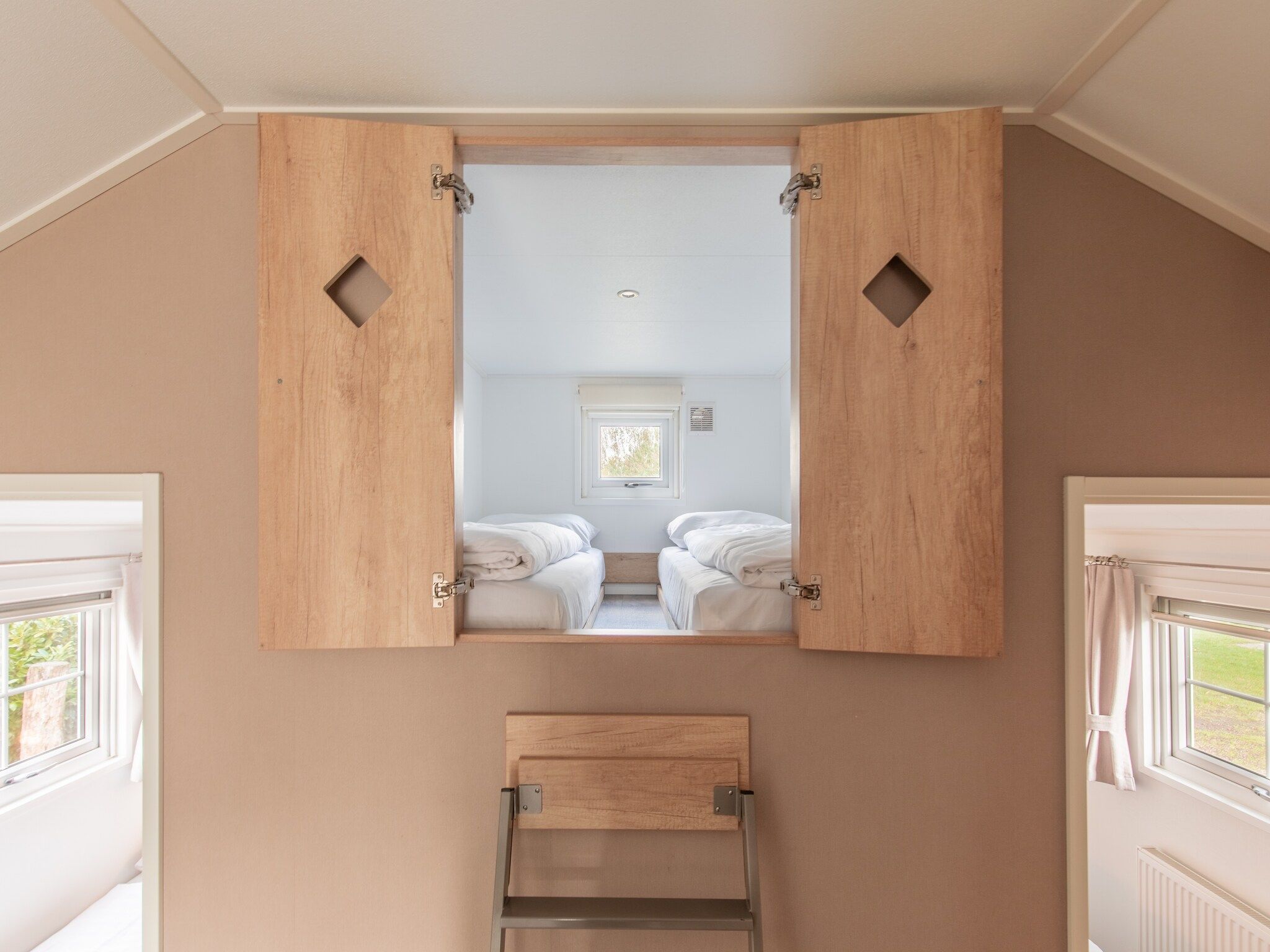 Een slaapkamer van Vakantiepark Leukermeer 12 in Well