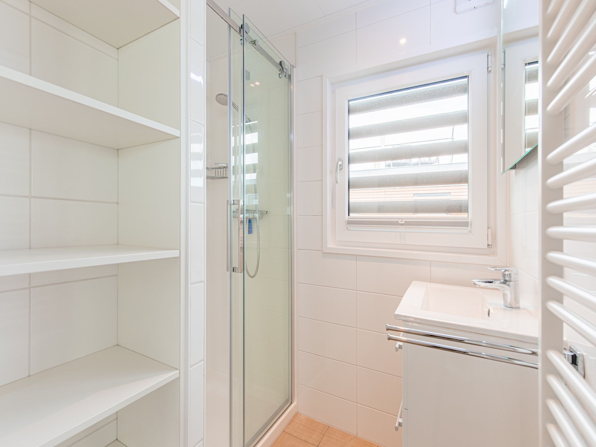 De badkamer van Vakantiepark Leukermeer 9 in Well