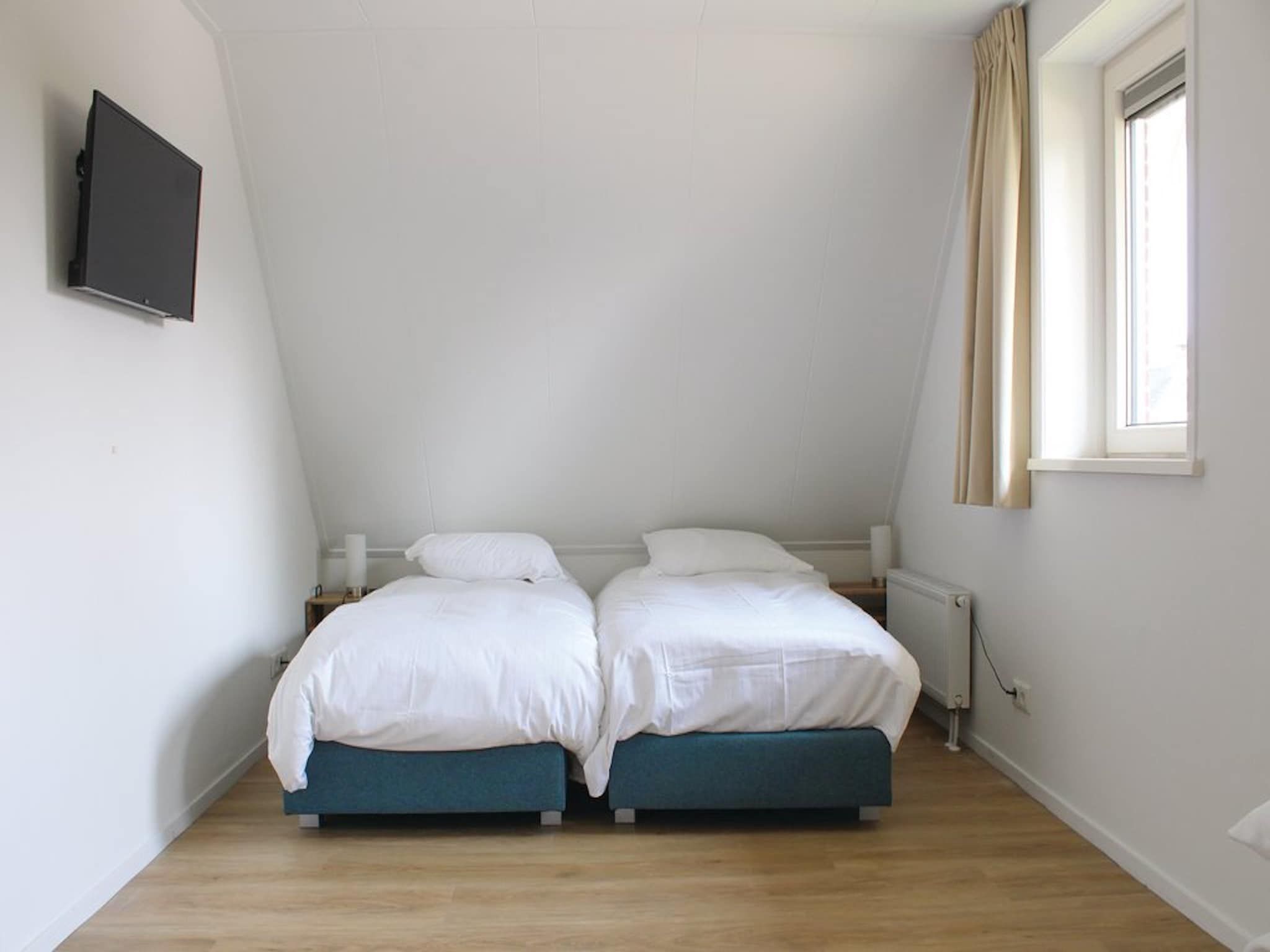 Een slaapkamer van Recreatiepark Idskenhuizen 4 in Idskenhuizen